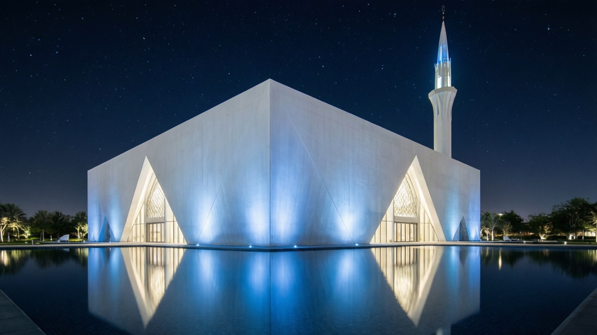 Education City Mosque Night 壁紙 — 一座現代白色清真寺，帶有發光的宣禮塔，在星空下的寧靜水池中完美倒映。