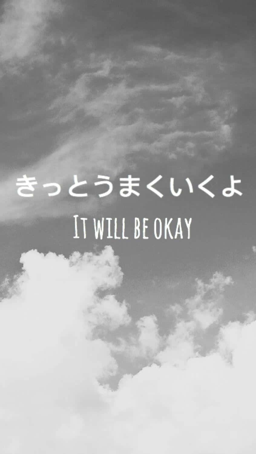  壁紙 — 單色天空配以柔和雲朵，以及英文和日文書寫的勵志文字「it will be okay」。