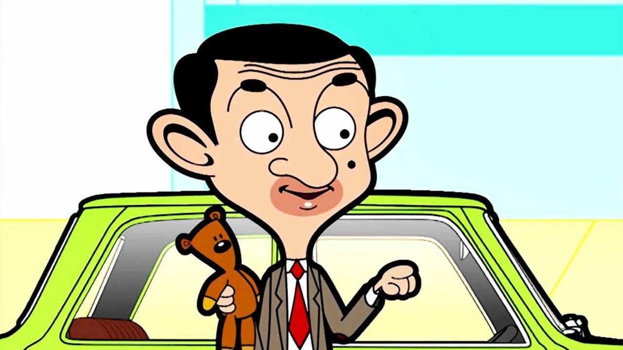 Funny Cartoon 桌布 壁紙 — Mr Bean 卡通角色抱著一隻泰迪熊，帶著驚訝的表情愉快地站在一輛萊姆綠色的汽車旁邊。