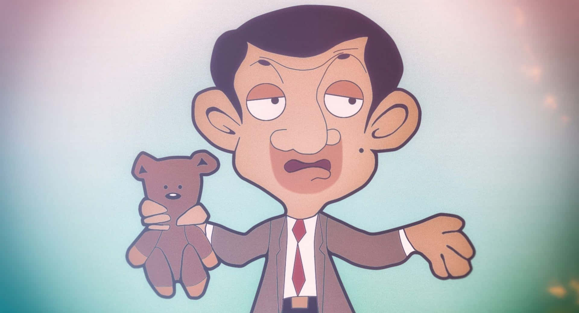 豆豆先生 桌布 壁紙 — Mr Bean 在柔和的漸變背景前，以驚訝的表情抱著一隻泰迪熊。