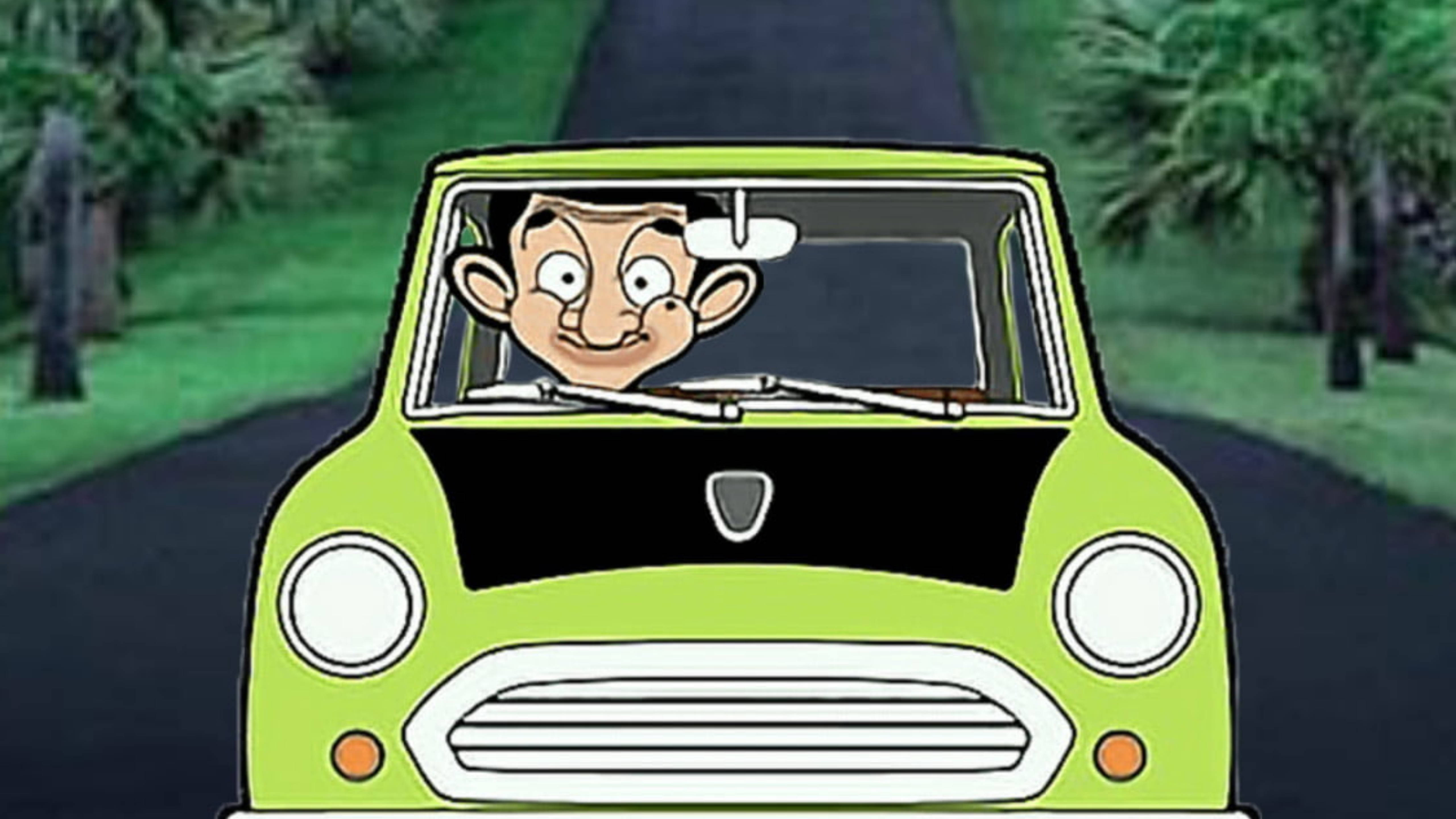 Funny Cartoon 桌布 壁紙 — Mr Bean 駕駛一輛萊姆綠色的 Mini Cooper 沿著綠樹成蔭的道路行駛，臉上掛著愉快的笑容。