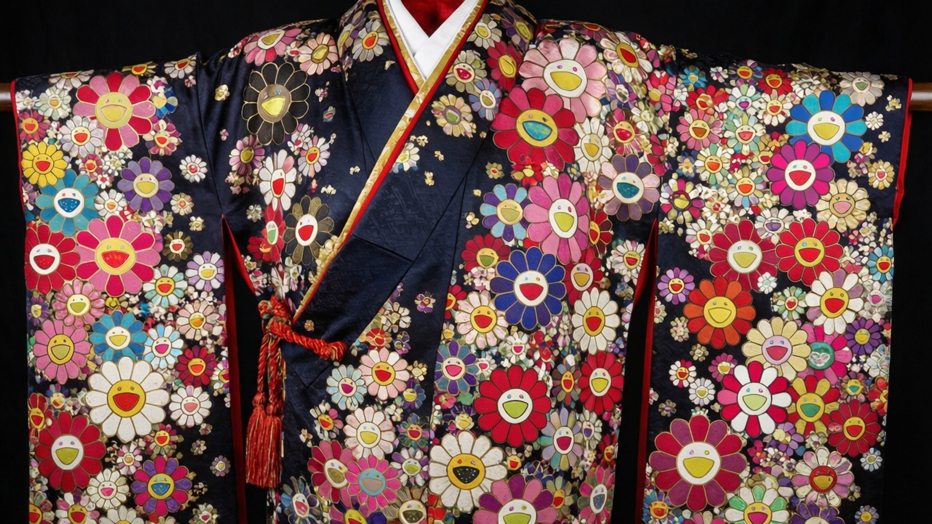 Kimono Flower Pattern 壁紙 — 深藍色和服，在深色背景上飾有鮮豔、大膽色彩的笑臉花卉圖案。