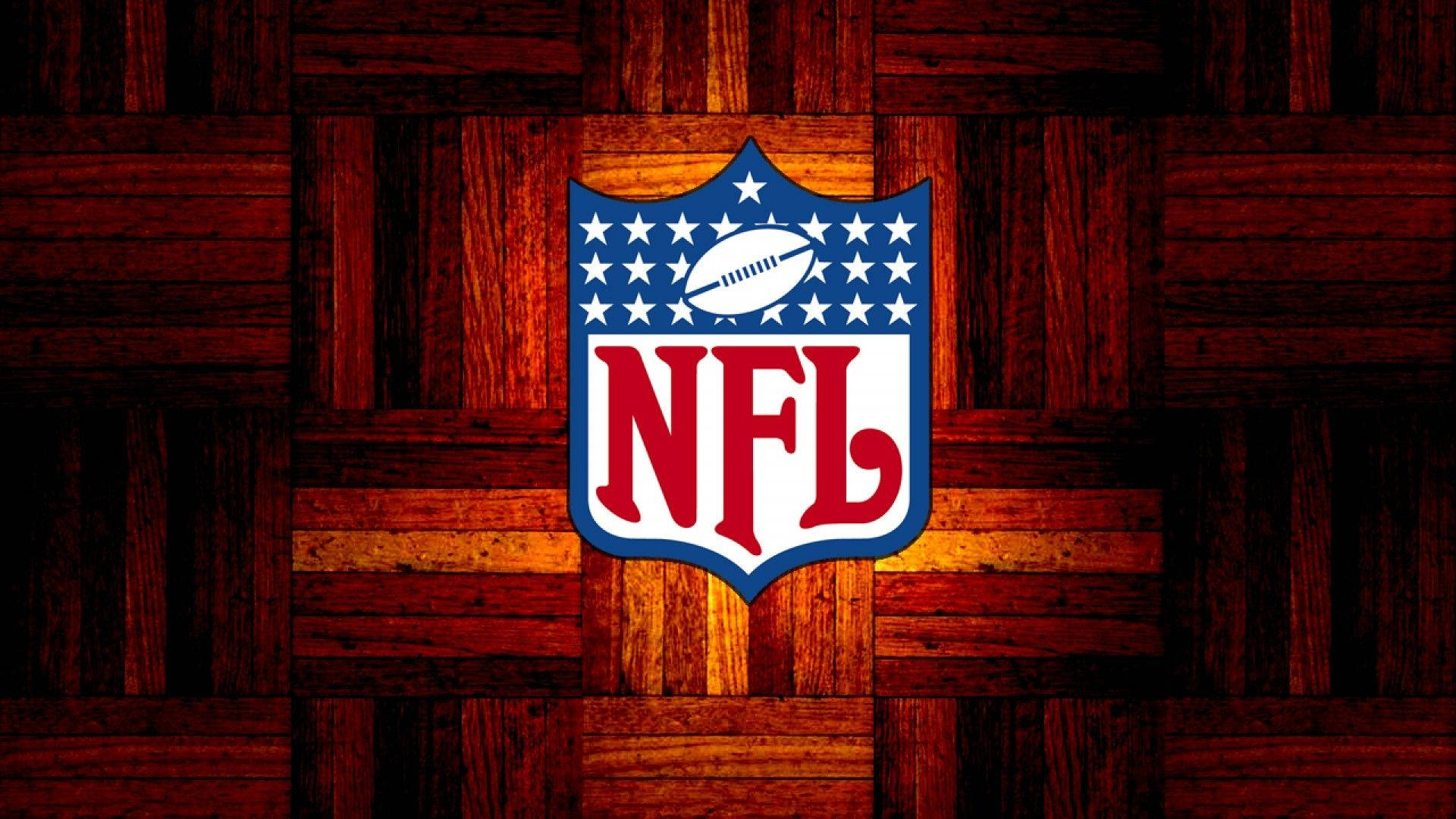 NFL Teams 桌布 壁紙 — NFL 標誌居中於暖色調木質拼花地板背景上，帶有發光高光。
