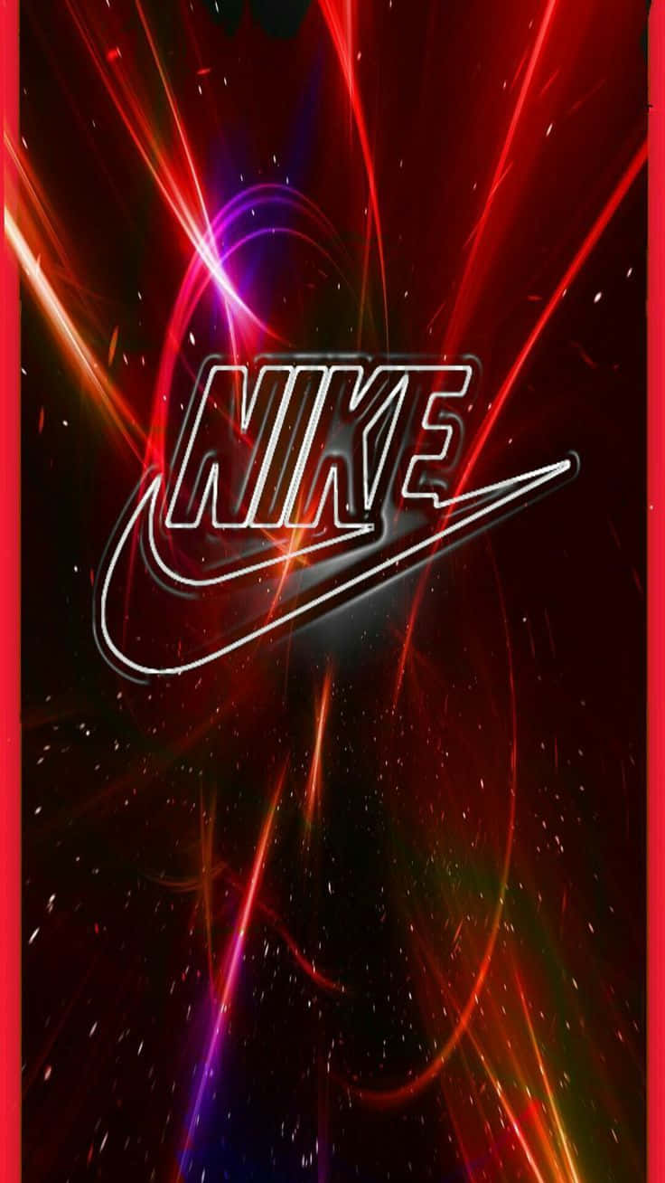 Red Nike 桌布 壁紙 — Nike 標誌在宇宙黑暗背景上閃爍著電光紅和紫色條紋，並帶有閃爍的粒子。