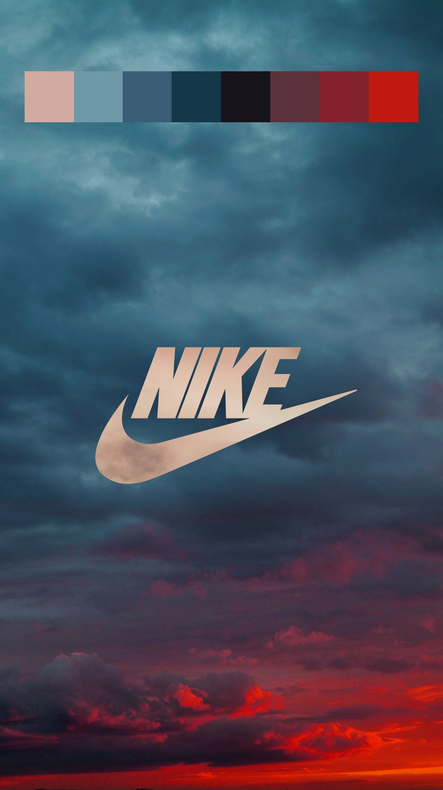 nike girl 桌布 壁紙 — Nike 標誌居中，背景為戲劇性的暮色天空，帶有漸變雲彩和頂部的顏色調色板條。