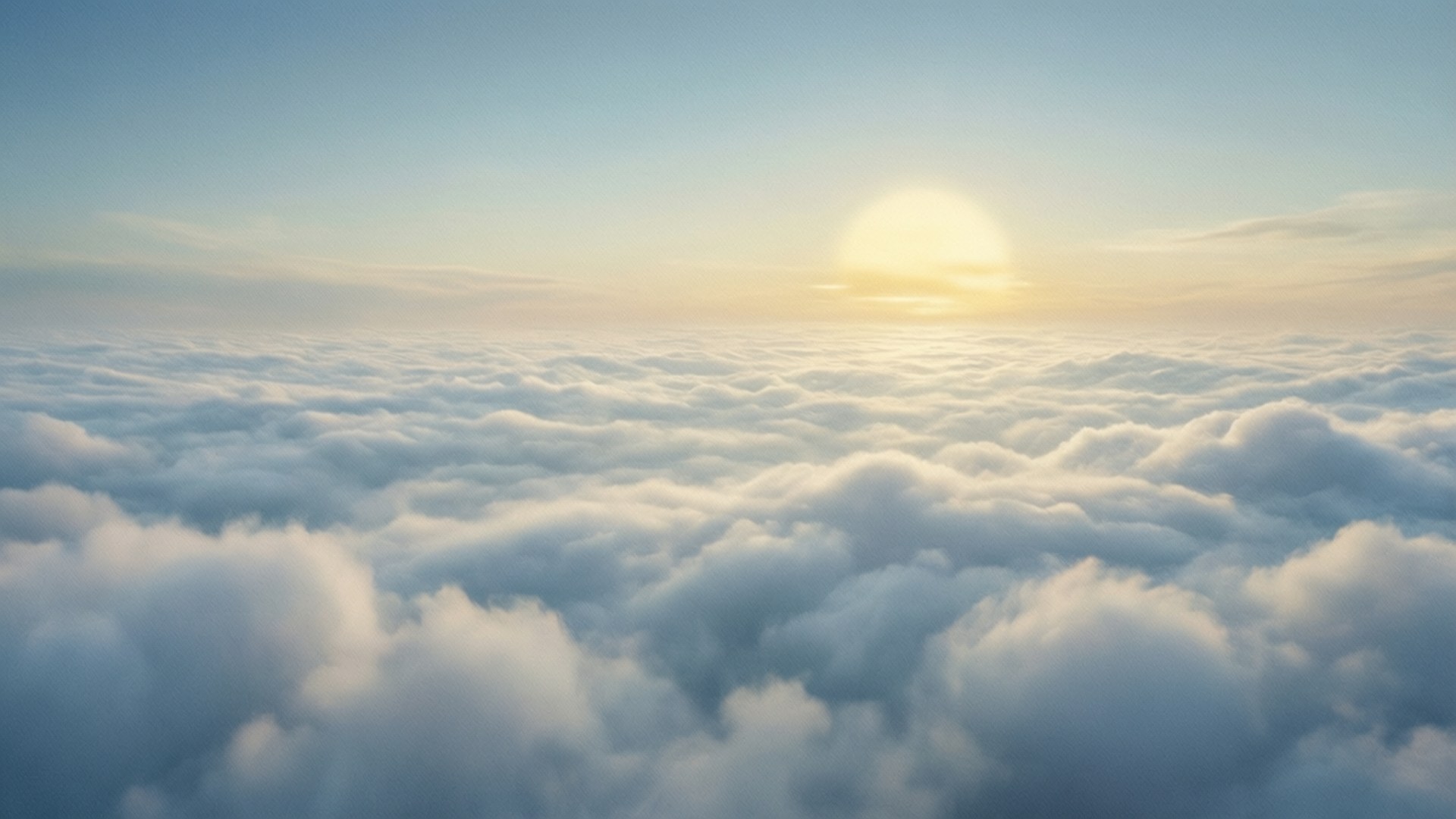 Endless Clouds Above 壁紙 — 寧靜的日出溫暖地照耀在延伸到地平線的廣闊蓬鬆白雲海洋上。
