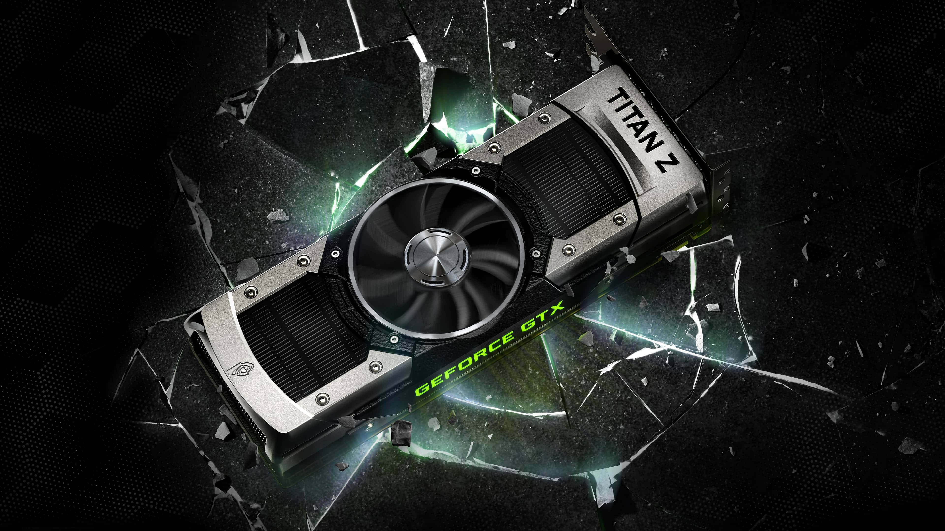 Nvidia 4K UHD 桌布 壁紙 — Nvidia GeForce GTX Titan Z 顯示卡在黑暗背景下以發光的綠色能量擊碎玻璃。