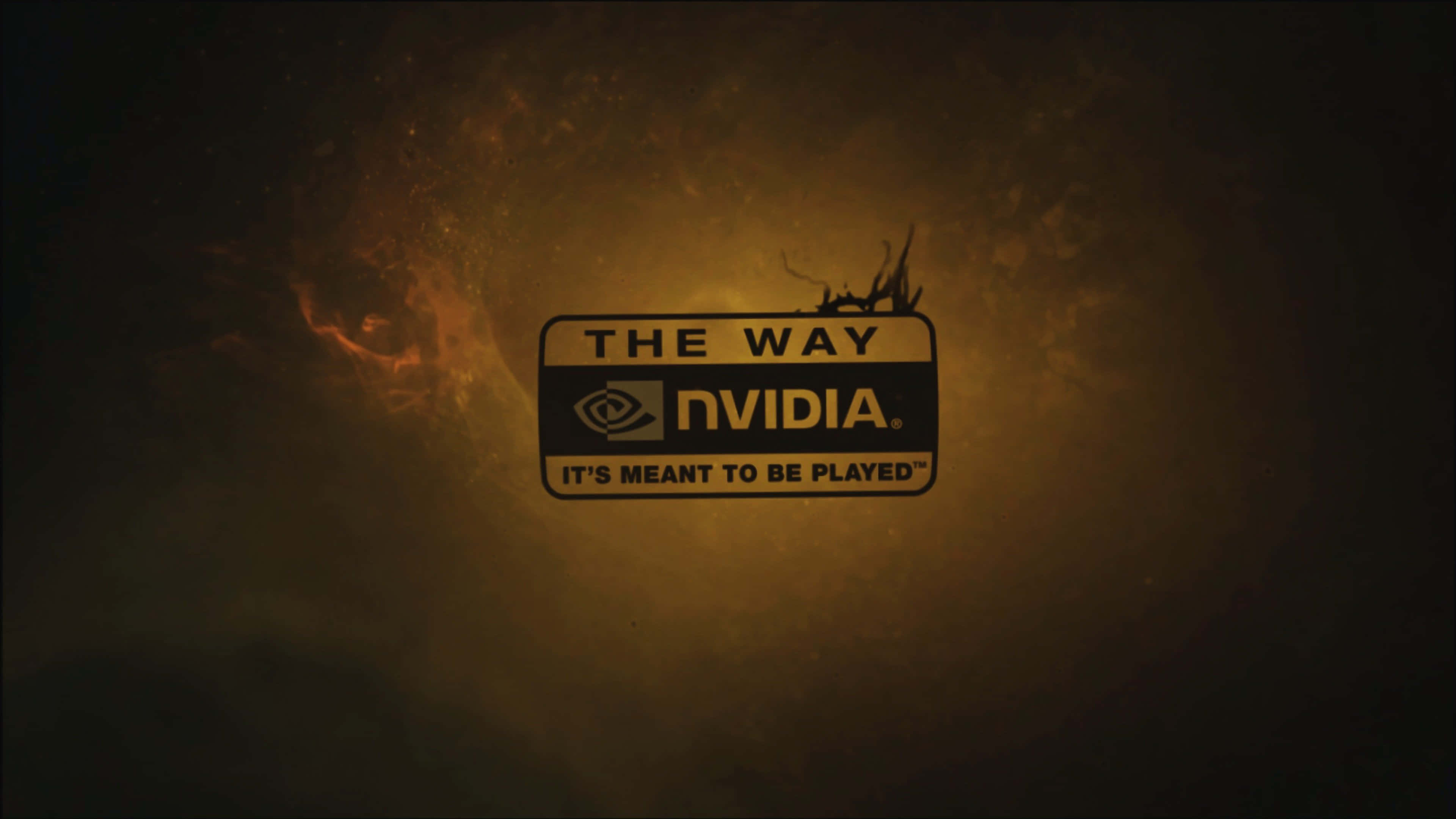 Nvidia 4K UHD 桌布 壁紙 — Nvidia 標誌在煙霧繚繞的火熱背景中溫暖發光，附有標語「The Way It's Meant to Be Played」。