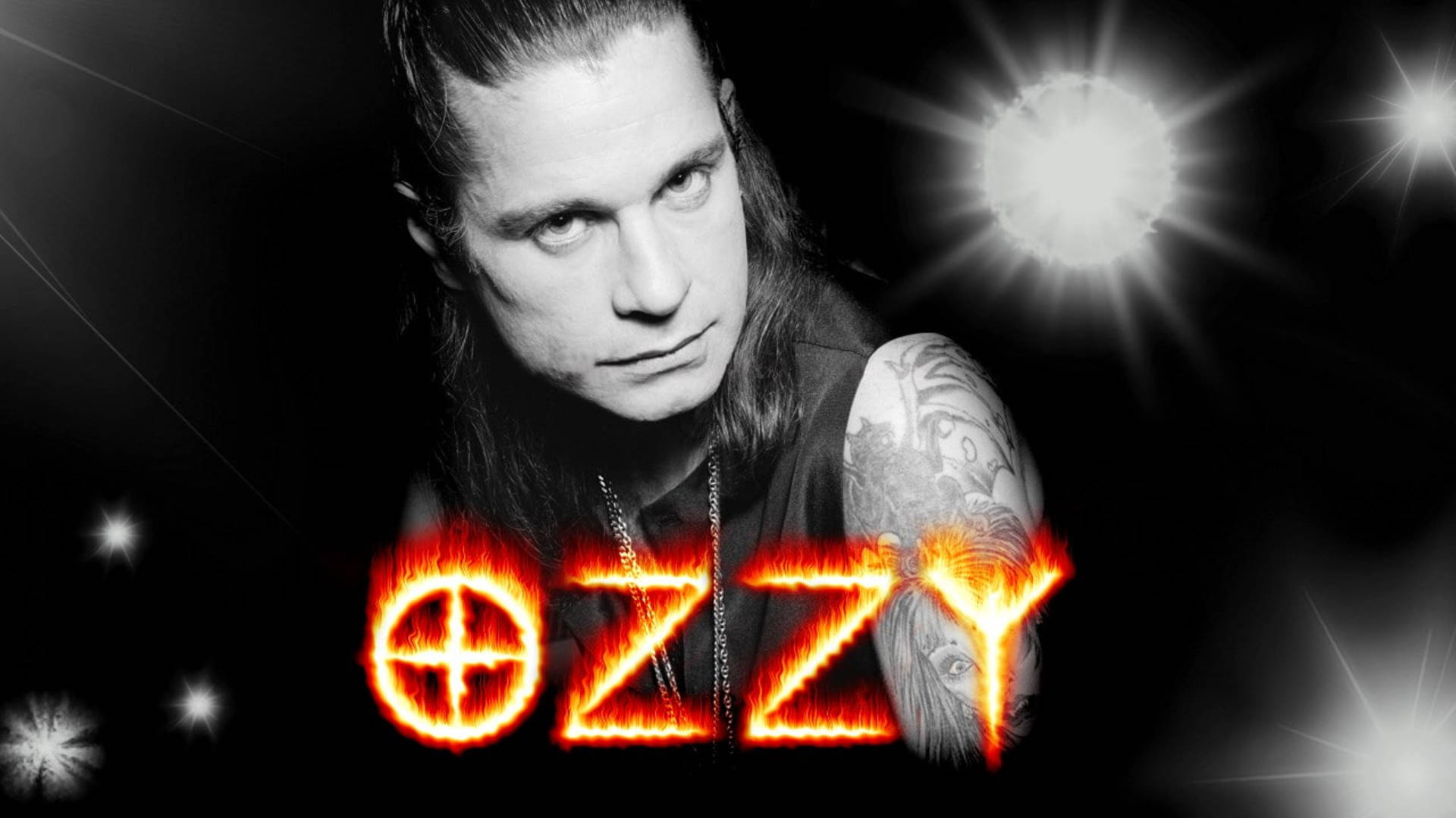Ozzy Osbourne 桌布 壁紙 — Ozzy Osbourne 在黑色背景上強烈凝視，帶有發光的星爆和火熱的橙色 'OZZY' 文字。