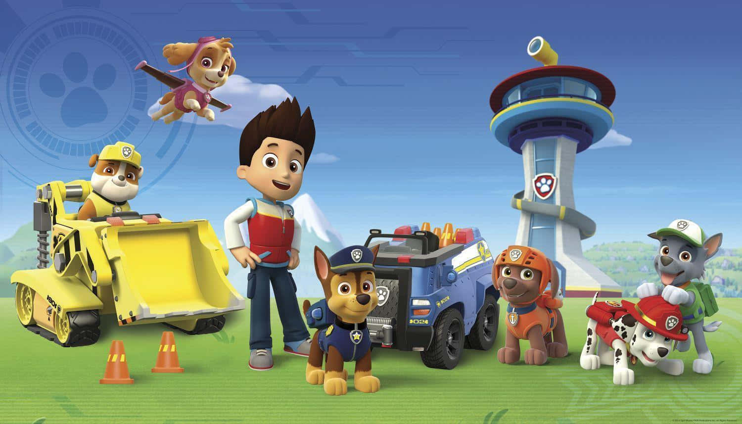 汪汪隊立大功 桌布 壁紙 — Paw Patrol 團隊在明亮的藍天和綠草地上與車輛和塔樓愉快地擺姿勢。