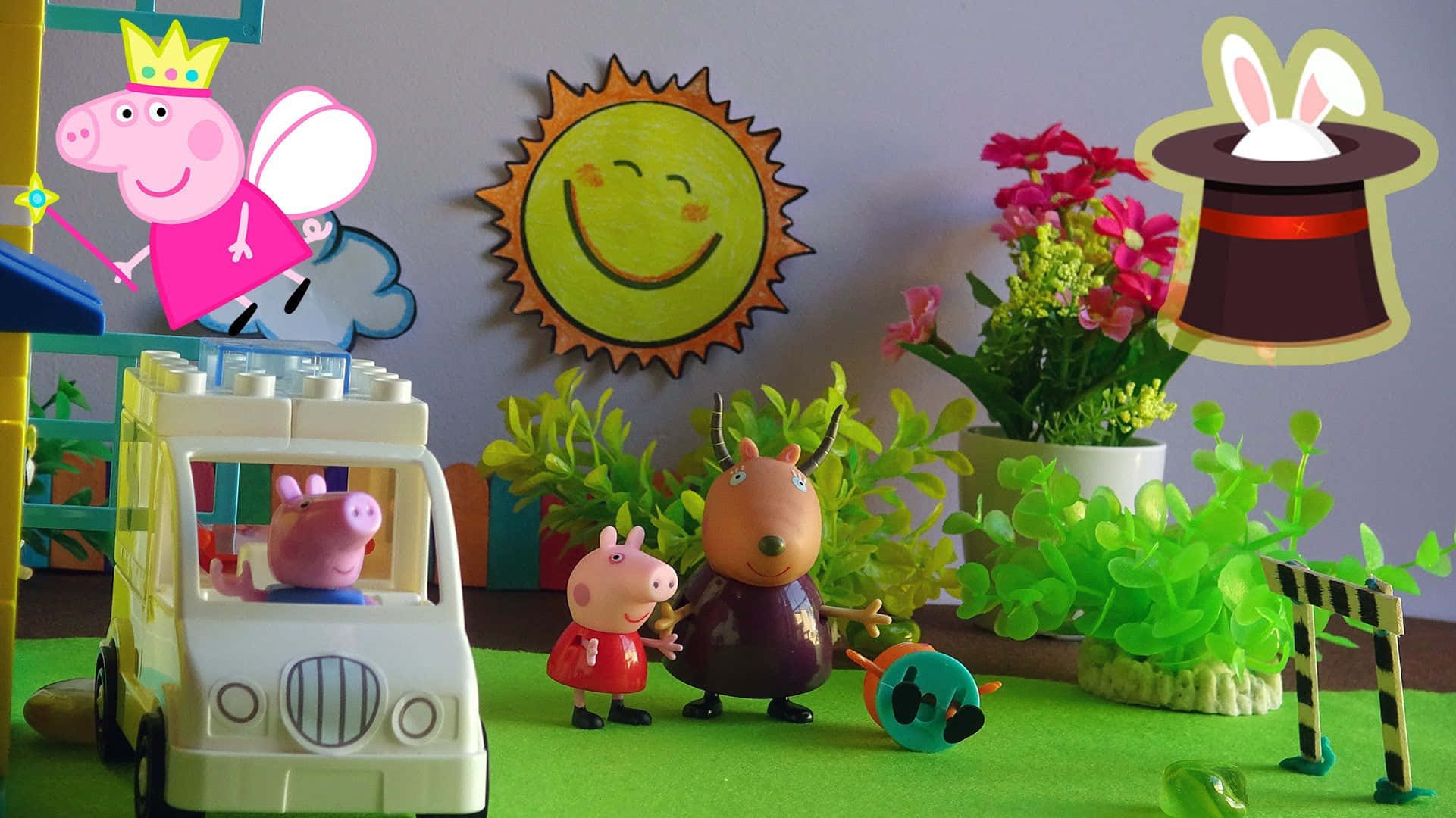 Candy Cat 桌布 壁紙 — Peppa Pig 和朋友們在一個色彩繽紛的玩具場景中，有微笑的太陽、魔法帽和綠色植物。