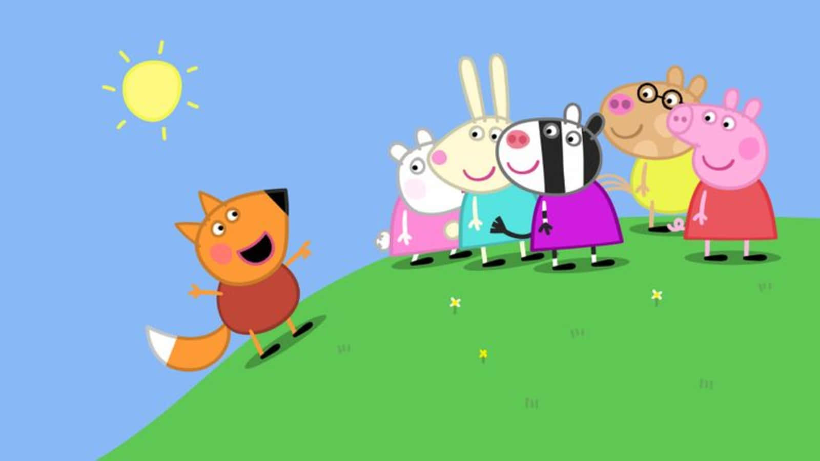 Freddy Fox 桌布 壁紙 — Peppa Pig 和朋友們站在一個長滿草的山丘上，在明亮的太陽下，一隻狐狸快樂地向他們跑來。