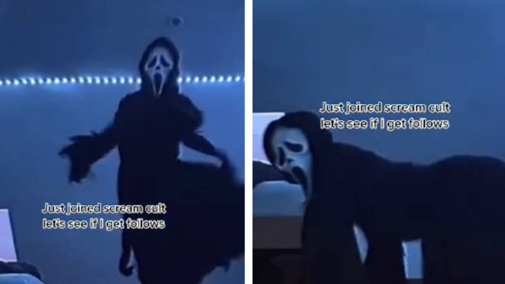 穿著鬼面服裝的人在藍色燈光的房間裡擺姿勢，帶有文字疊加。 — Meme 壁紙