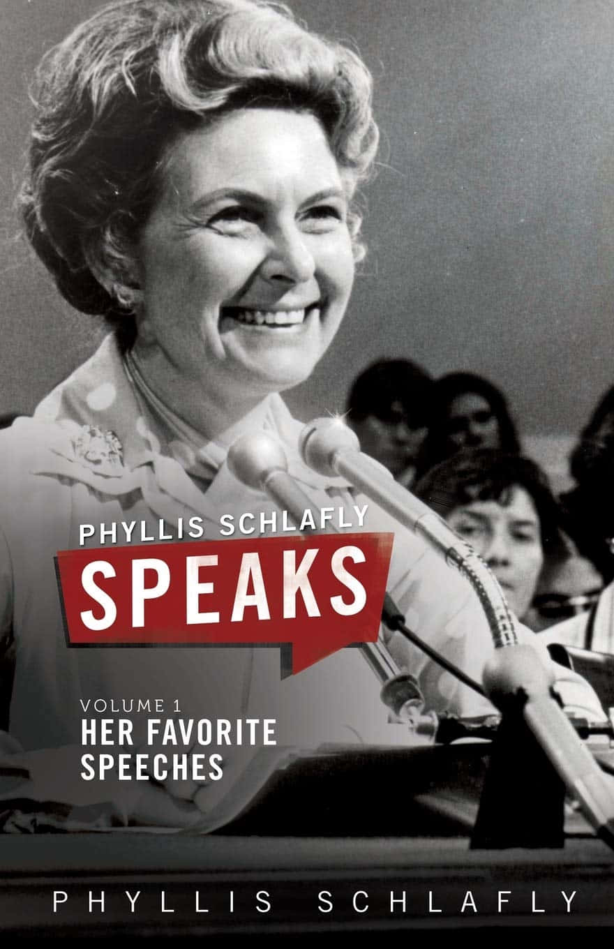 手機 桌布 壁紙 — Phyllis Schlafly 在公開活動中對著麥克風溫暖微笑，身後有模糊的觀眾。