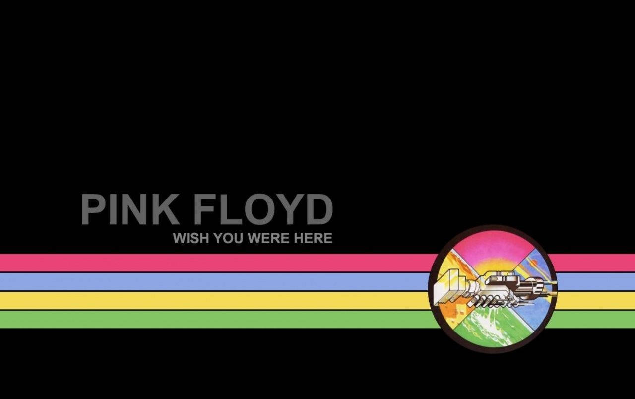 Floyd 桌布 壁紙 — Pink Floyd 專輯封面，帶有彩虹條紋和飛越地球的太空船，背景為黑色。