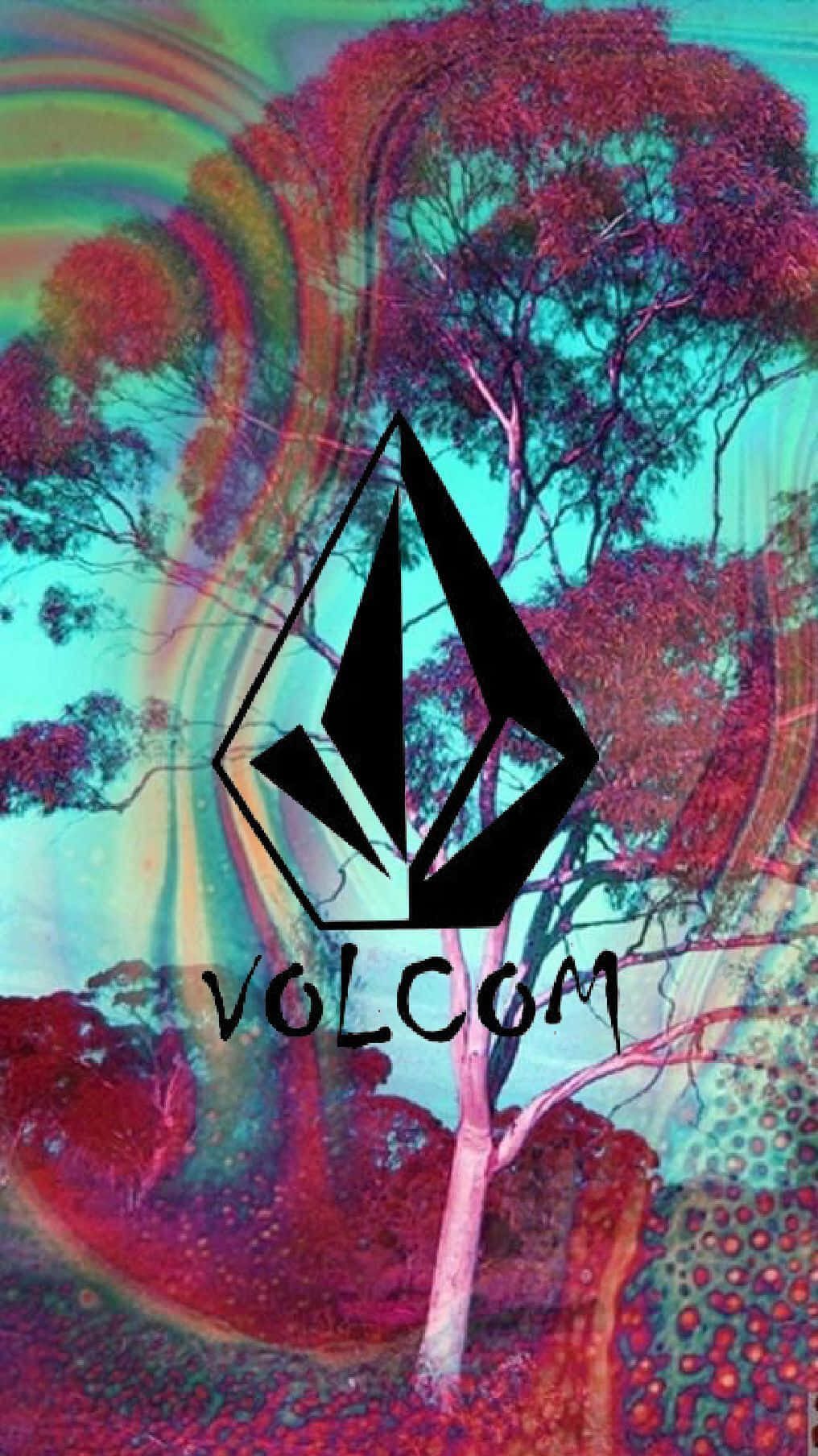  壁紙 — 一張迷幻數位藝術桌布，在超現實的樹木上帶有 Volcom 標誌，樹木呈現旋轉的彩虹色和紅色樹葉。