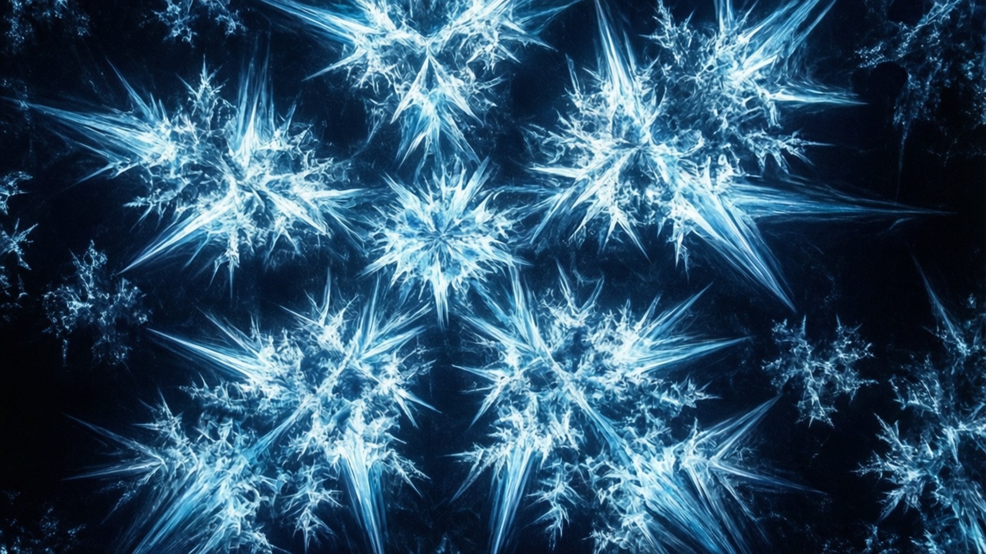 Cold Fractal Ice 壁紙 — 在深藍色虛空中，閃耀的藍色碎形雪花綻放出複雜的晶體尖刺。