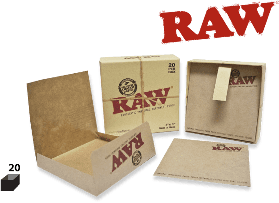 Old Paper 桌布 壁紙 — RAW品牌捲菸紙展示，包括打開的盒子及散裝紙張，背景為純黑色。