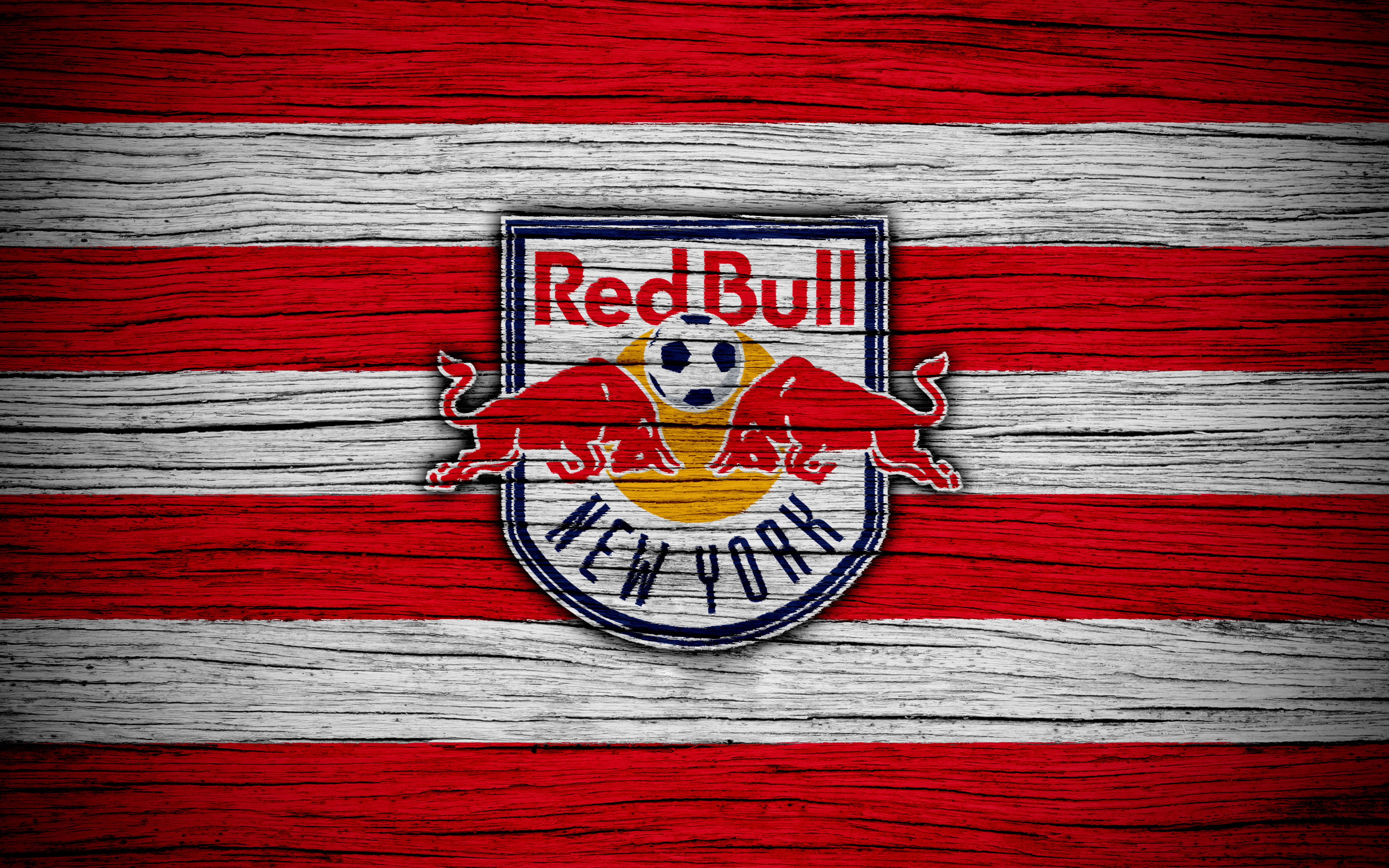 bull 桌布 壁紙 — Red Bull New York 足球隊標誌縫在紅白條紋木板上。