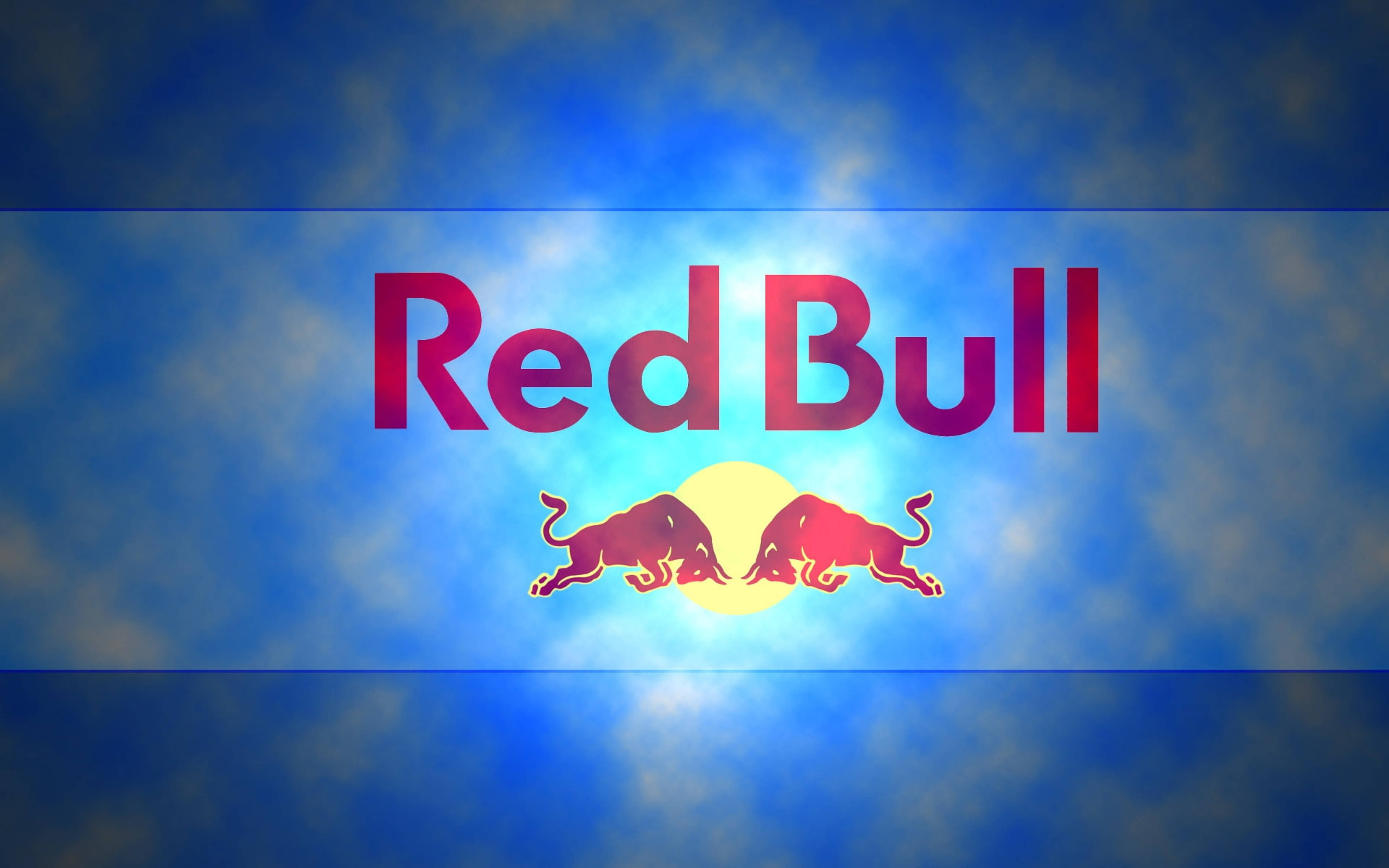 bull 桌布 壁紙 — Red Bull 標誌，兩頭衝鋒的公牛在充滿活力的藍天和發光的太陽背景下。
