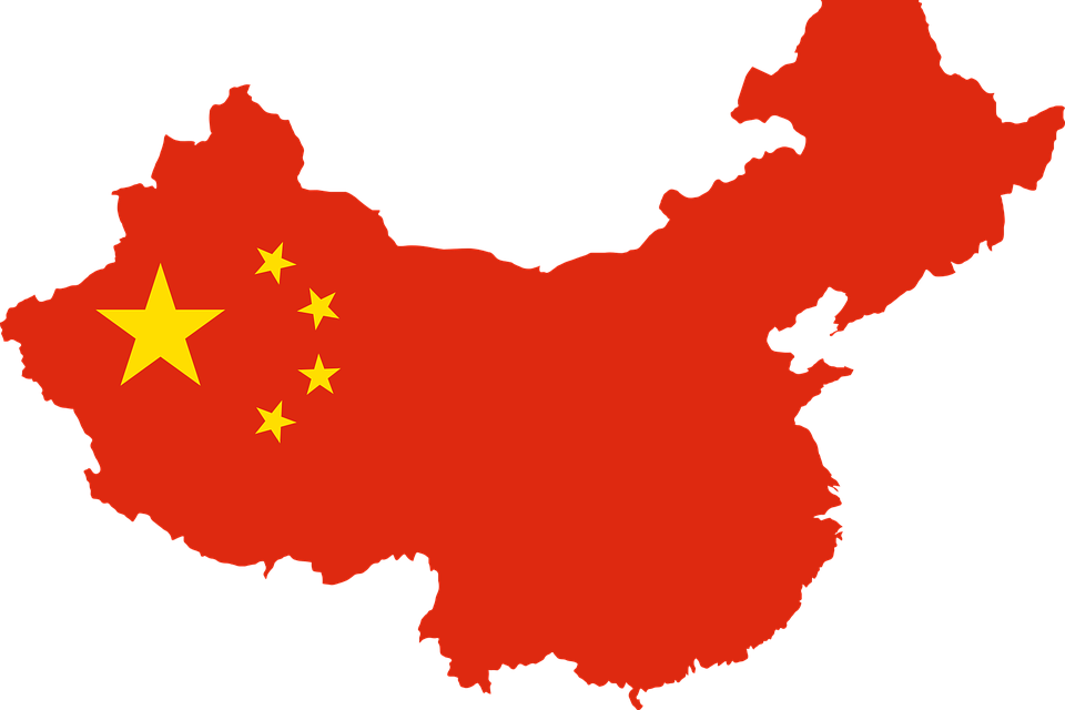 紅色中國地圖輪廓，帶有與國旗設計相匹配的黃色星星。 — 中國 壁紙