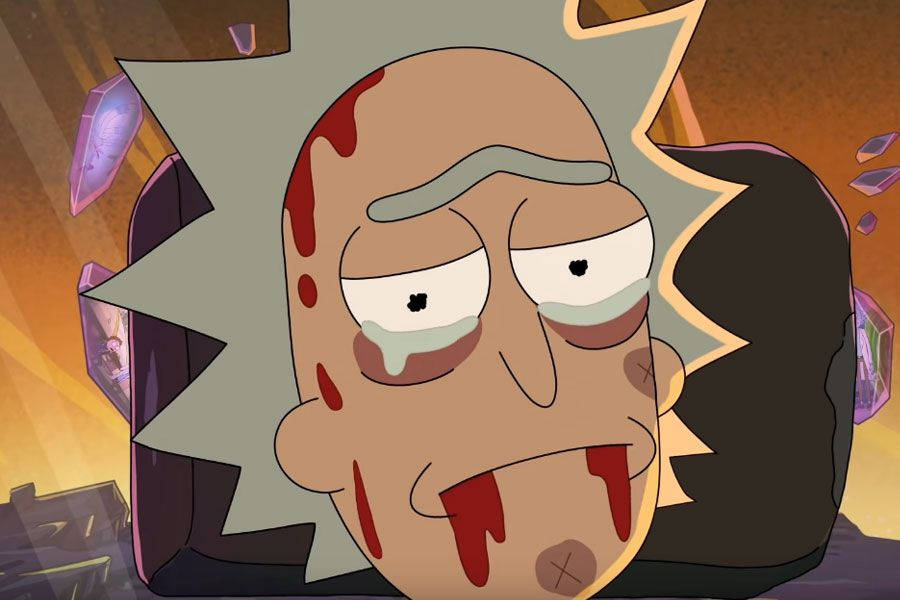 瑞克和莫蒂 桌布 壁紙 — 《Rick and Morty》中的Rick Sanchez看起來筋疲力盡且受傷，臉上滴著血，背景溫暖發光。