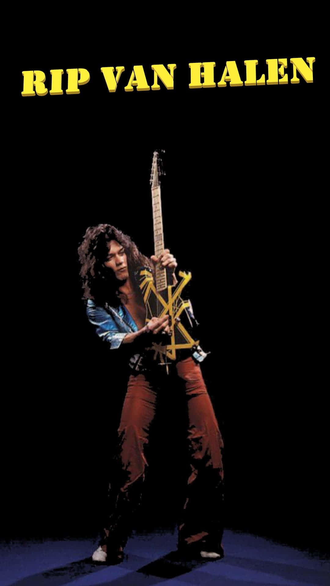Rip 桌布 壁紙 — Rip Van Halen 站在舞台中央，在黑色背景的戲劇性聚光燈下拿著一把黃色吉他。