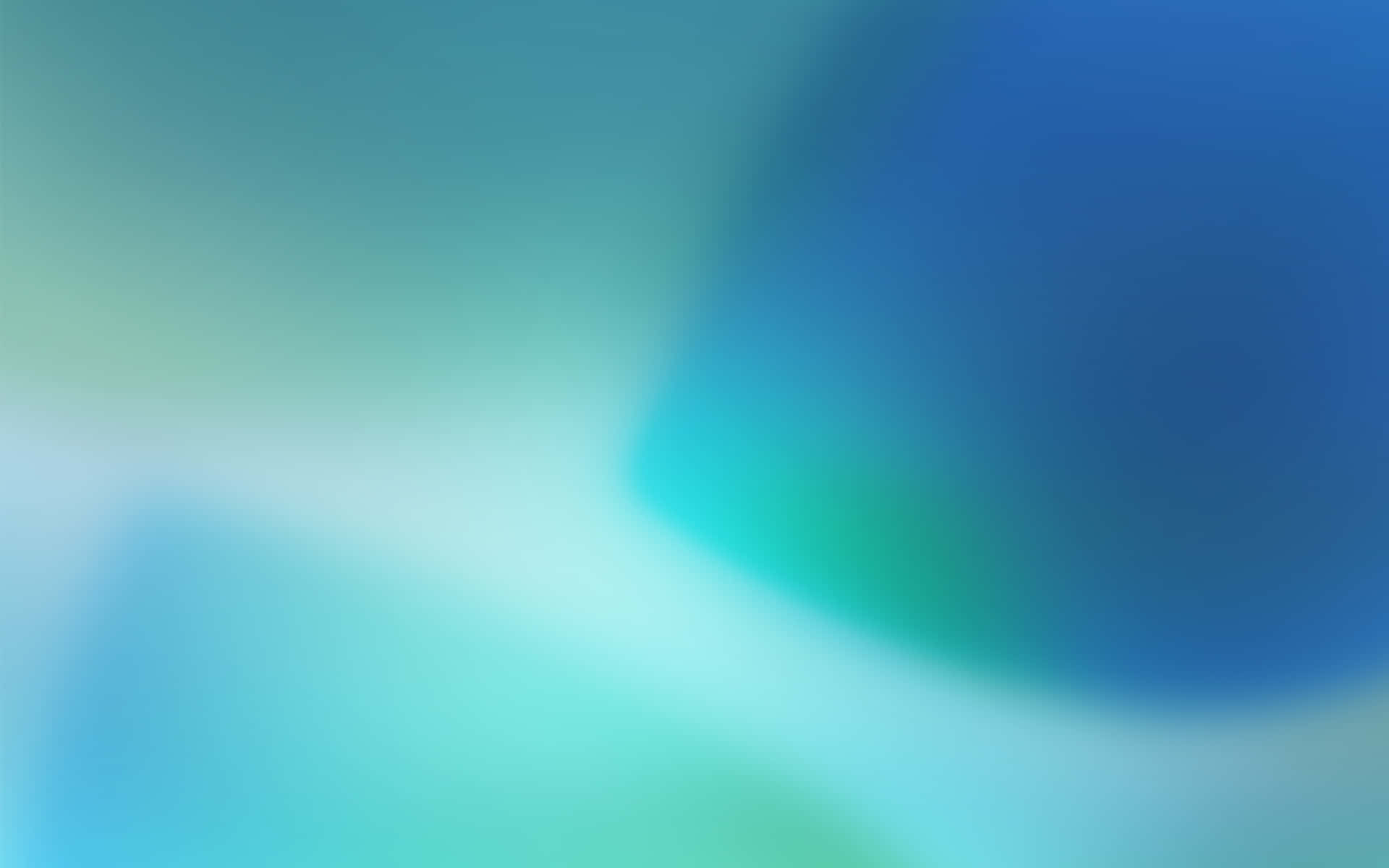  壁紙 — 柔和的青綠色與藍色漸變，融合成夢幻的抽象模糊效果。