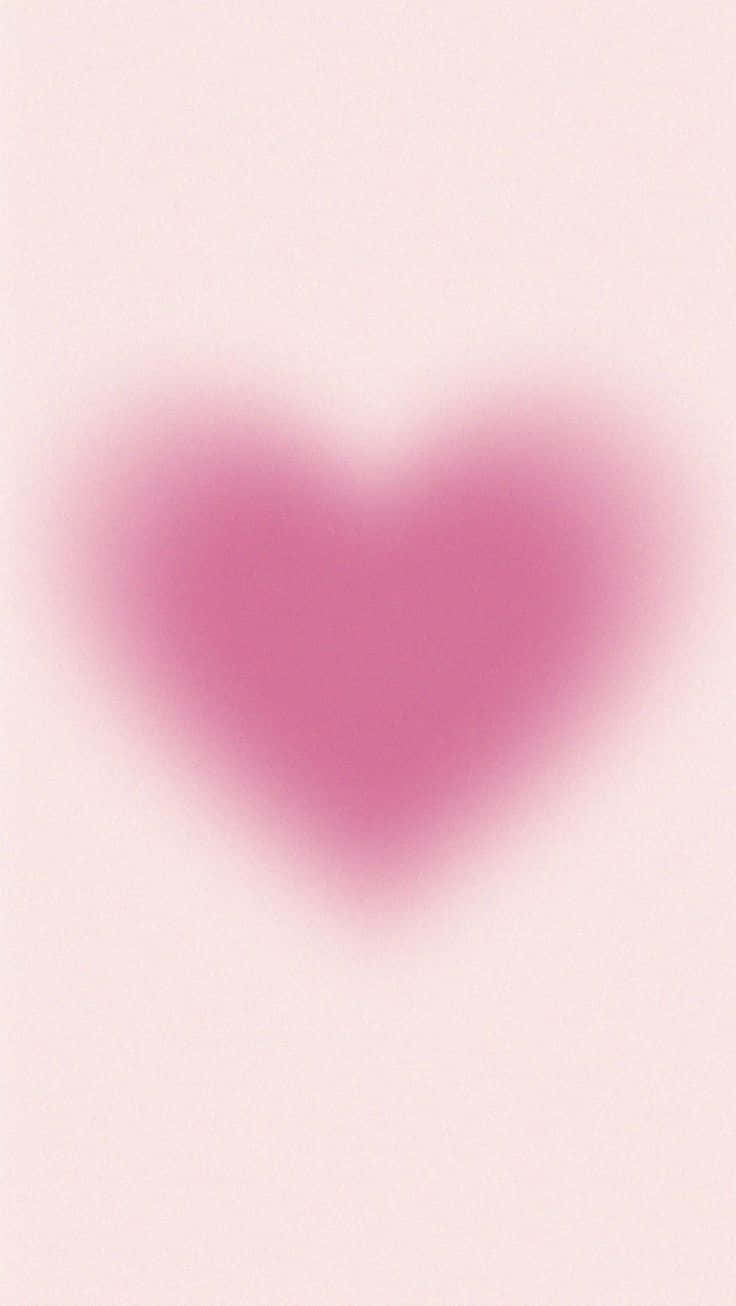 Pink Heart Aura 桌布 壁紙 — 柔和的粉紅色心形在淡粉紅色背景上輕輕模糊，營造出夢幻浪漫的氛圍。