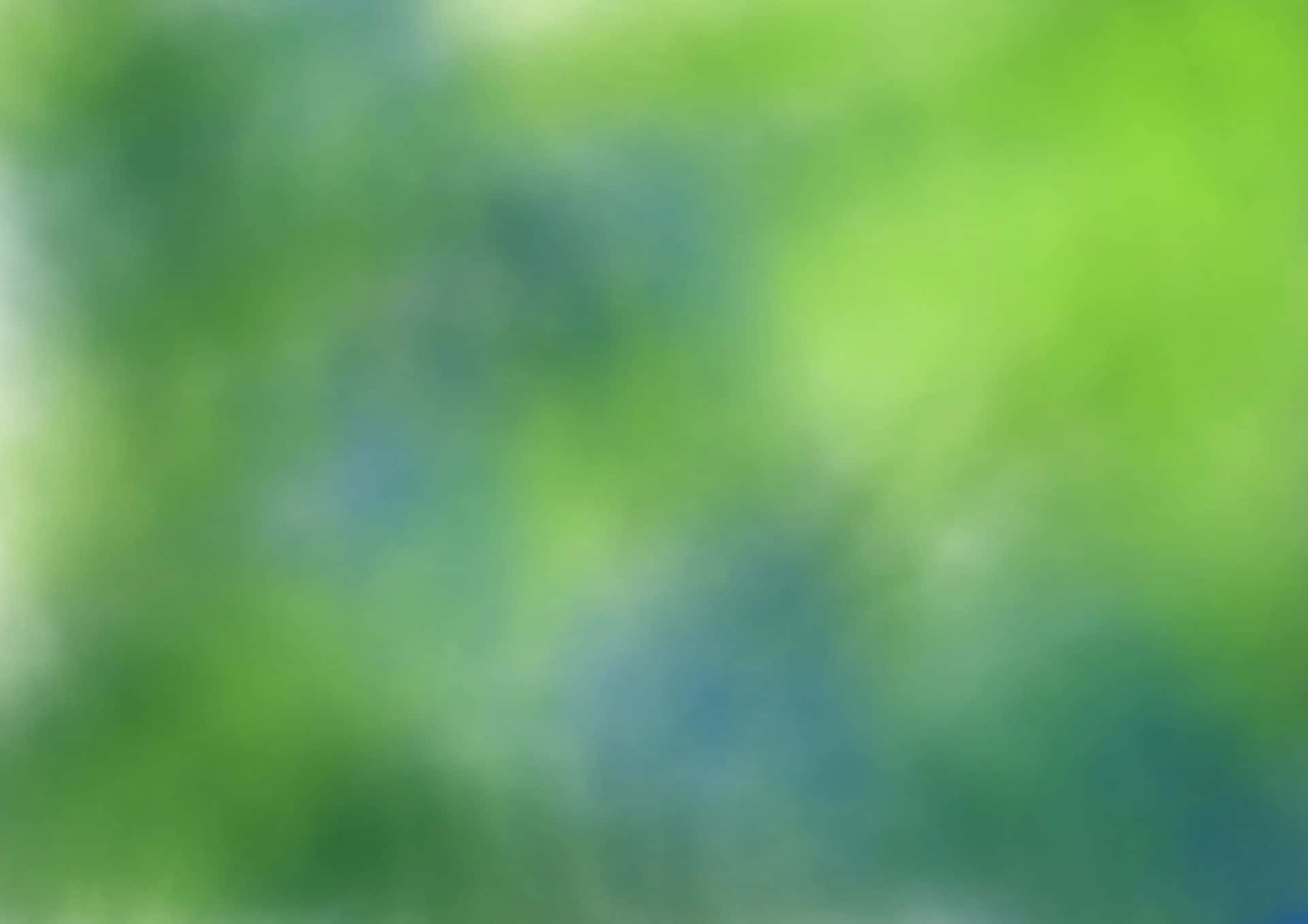  壁紙 — 柔和模糊的鮮綠色和藍色漸變，營造出寧靜的自然氛圍。