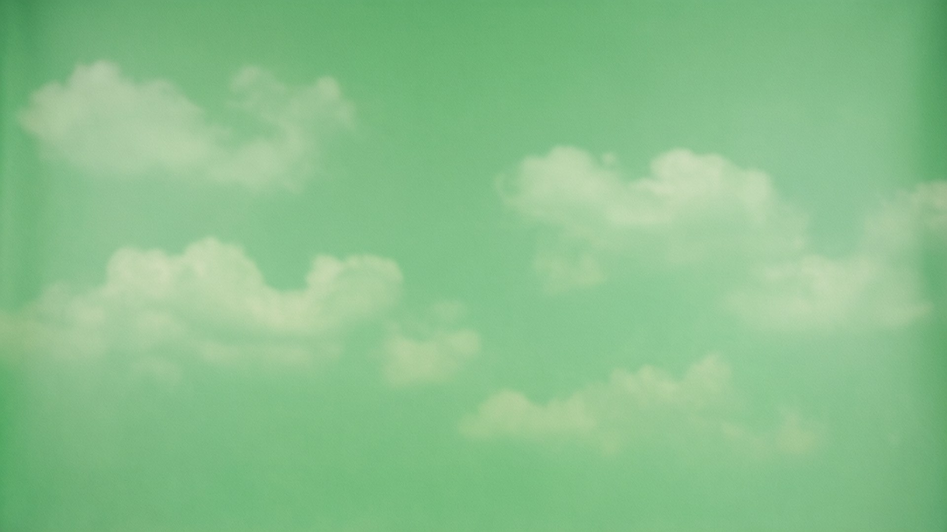 桌布 壁紙 — 柔軟的白雲在夢幻的薄荷綠天空中慵懶地飄浮，營造出寧靜平和的場景。
