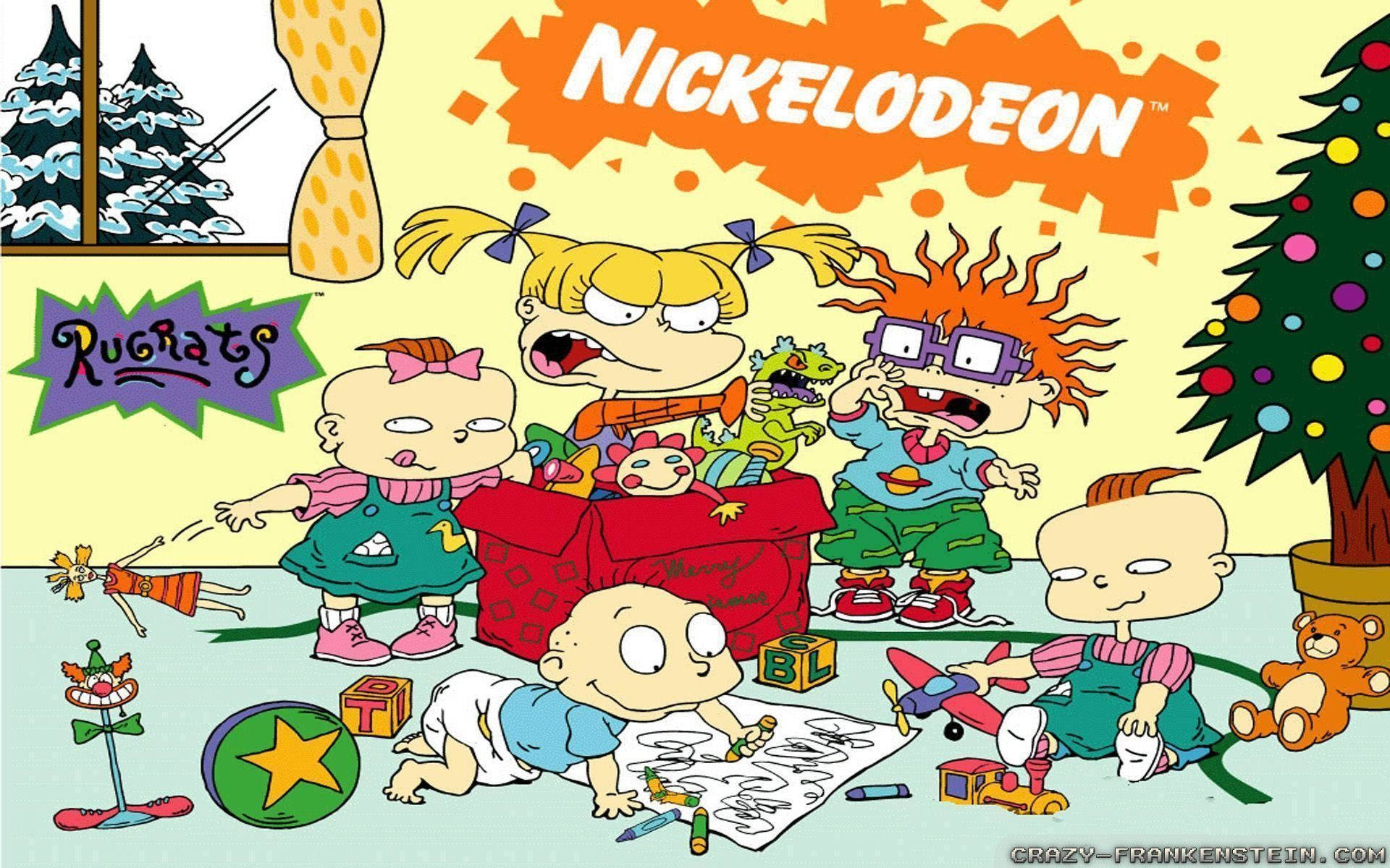 小孩動圖 桌布 壁紙 — Rugrats 角色在色彩鮮豔的卡通房間裡，圍繞著聖誕樹、玩具和禮物盒混亂地玩耍。