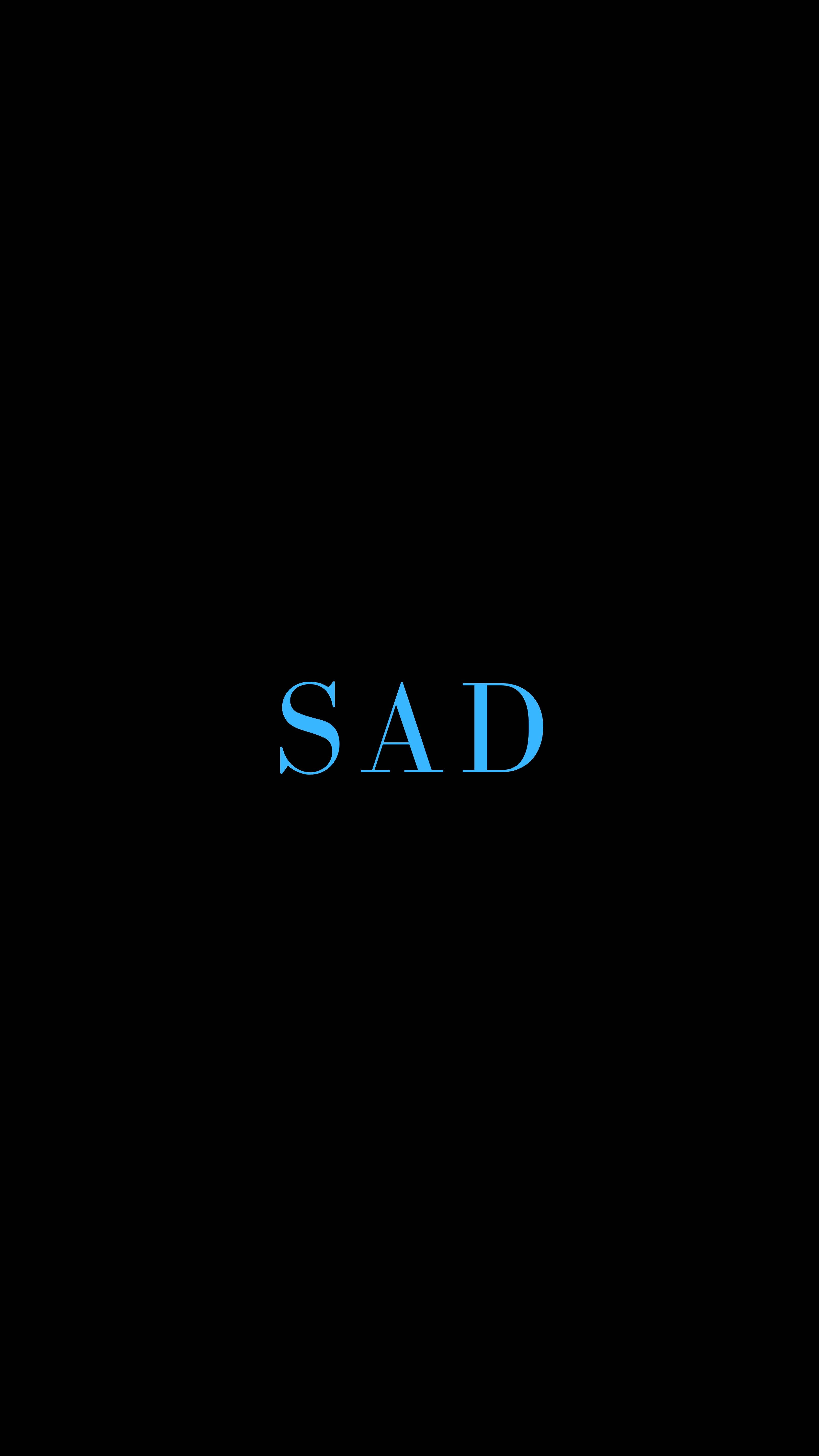 傷心 桌布 壁紙 — 「SAD」這個字在純黑色背景上發出青色的光芒，傳達出一種極簡和憂鬱的情緒。