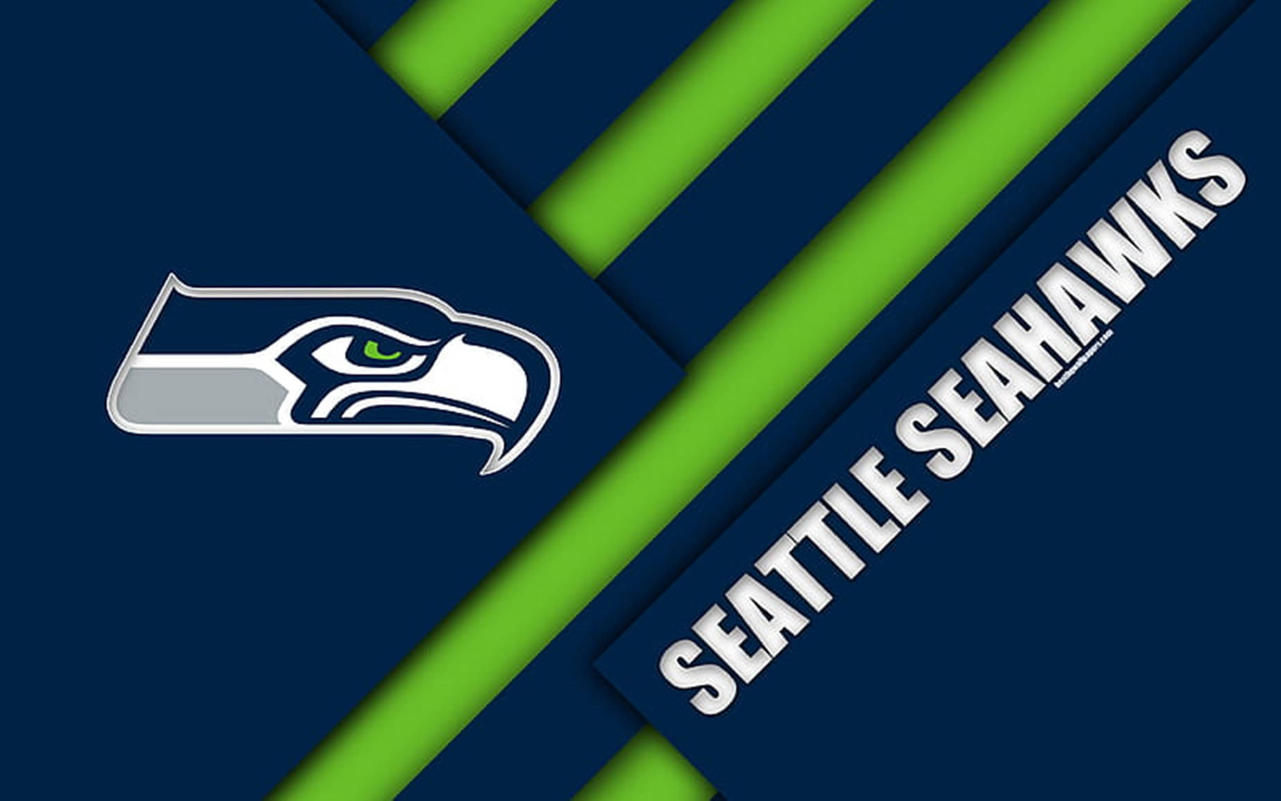 海鷹隊 桌布 壁紙 — Seattle Seahawks 標誌及球隊名稱以白色粗體文字顯示在海軍藍與螢光綠的斜紋上。