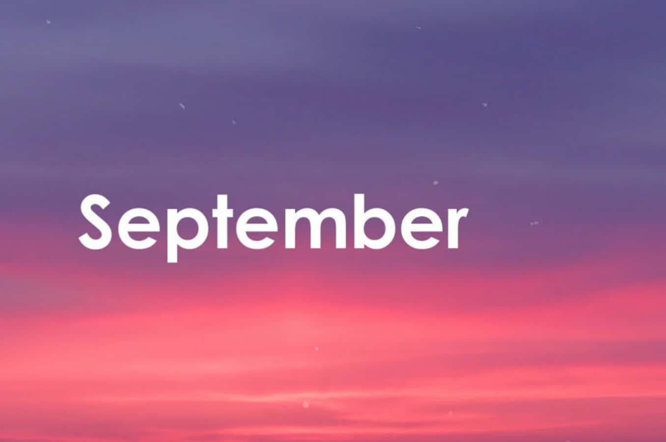 September 桌布 壁紙 — 「September」一詞漂浮在黃昏時分紫色和粉紅色的漸變天空中。