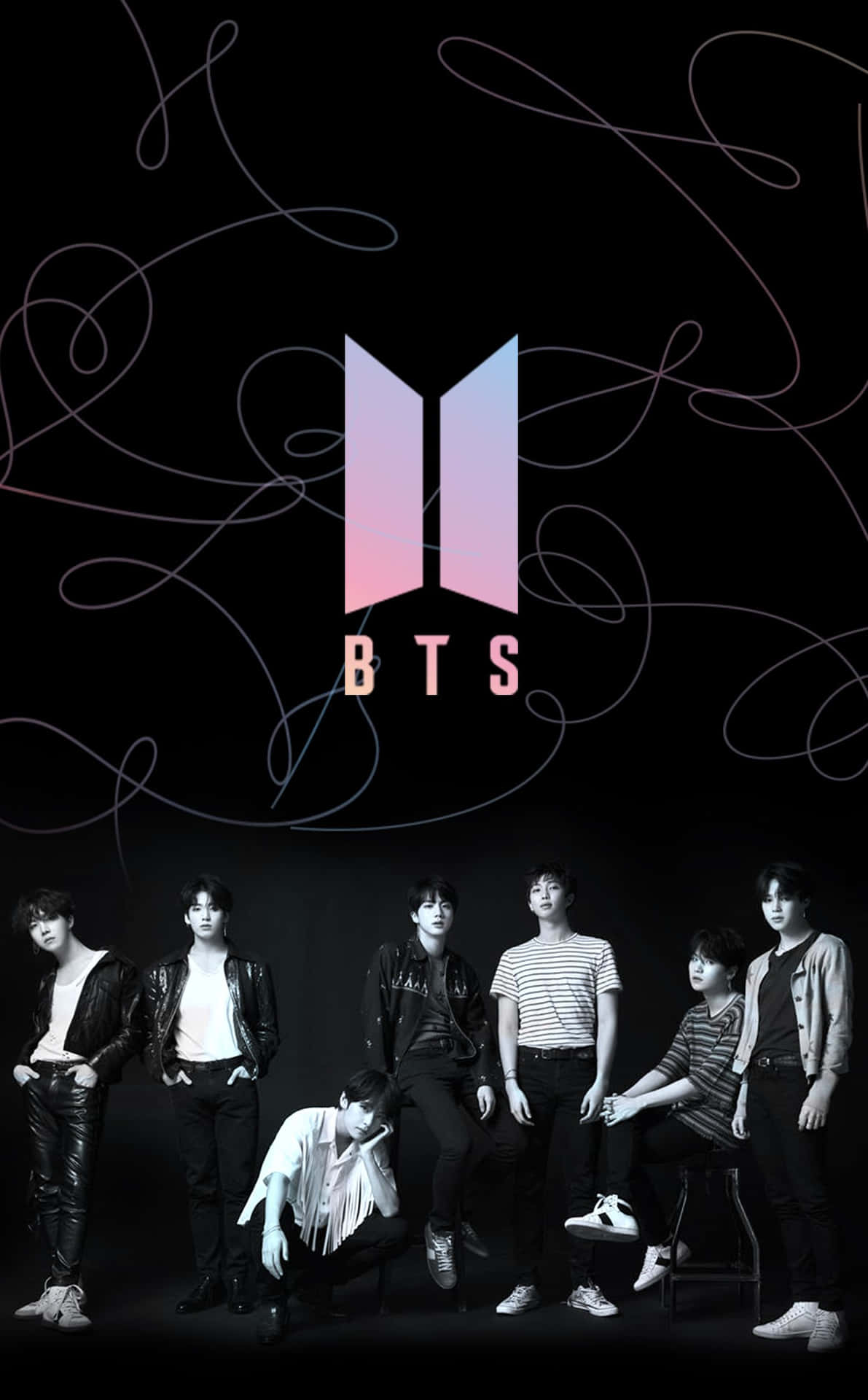 BTS 樂團成員在攝影棚內擺姿勢，上方有發光的標誌。 — Bts 壁紙