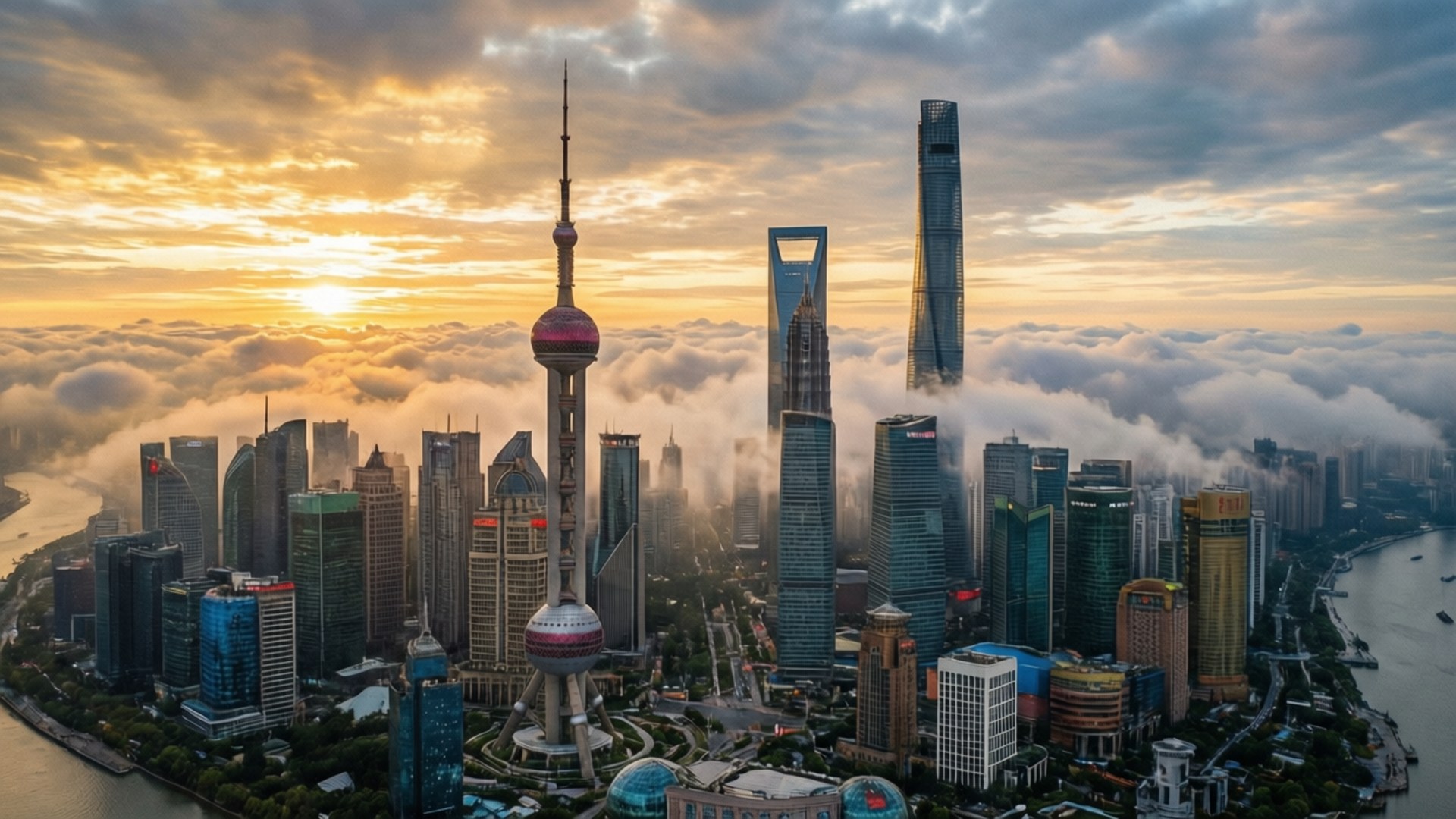 Skyline at Dawn 壁紙 — 上海天際線的鳥瞰圖，日出時雲層在摩天大樓下方，包括東方明珠塔和上海中心大廈。