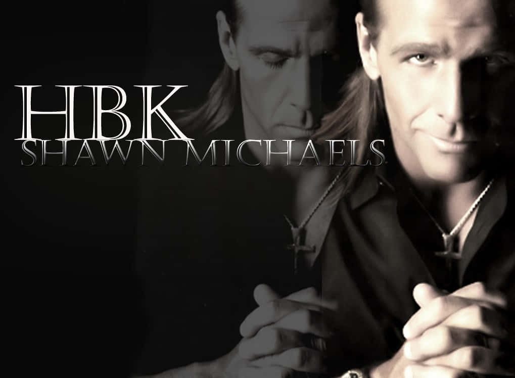 摔角 桌布 壁紙 — Shawn Michaels 的戲劇性黑白肖像，帶有雙重曝光效果和粗體文字疊加。