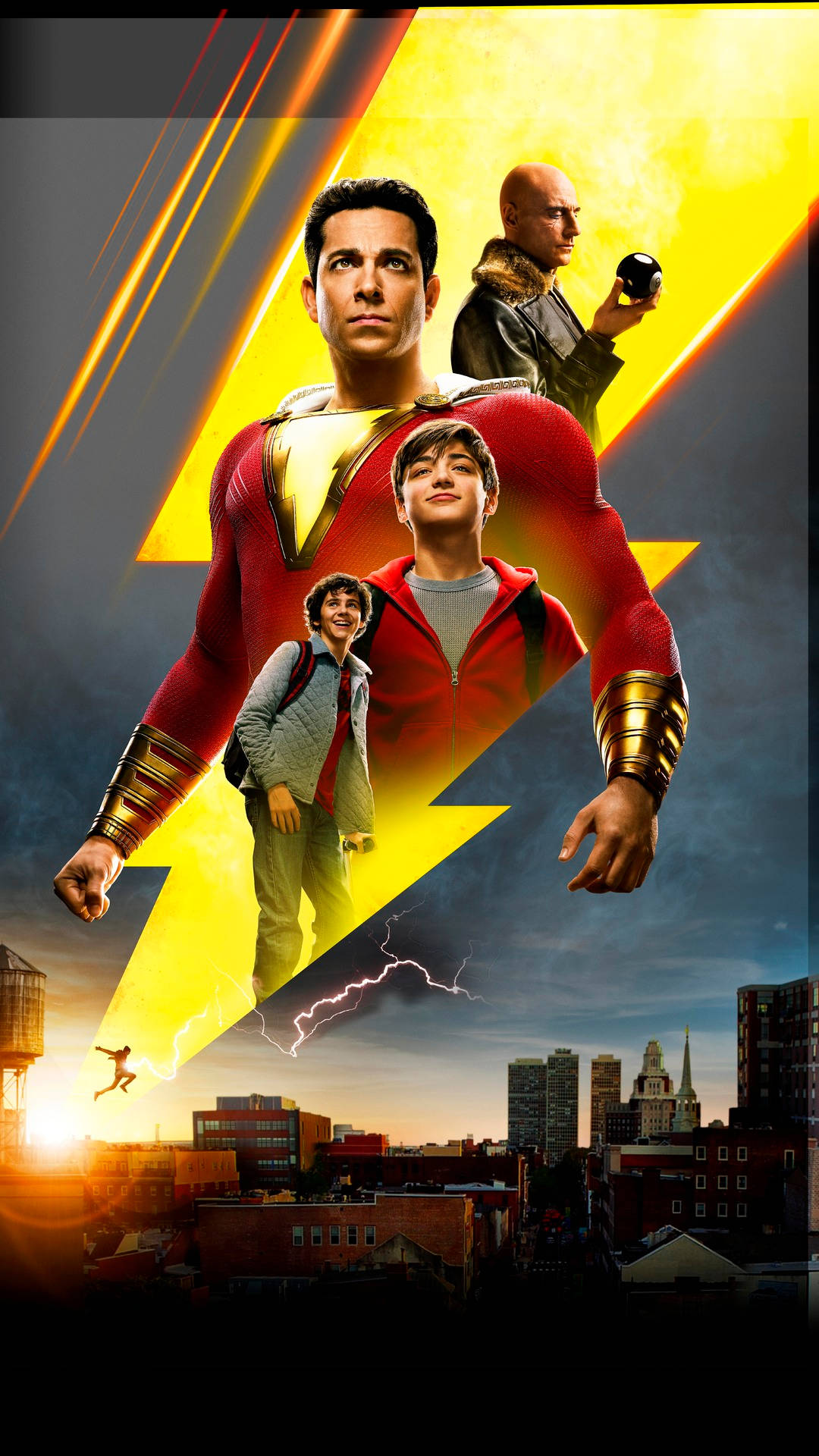 超級英雄 桌布 壁紙 — Shazam! 超級英雄海報，四個角色疊加在日落時分的城市景觀上，並有發光的閃電。