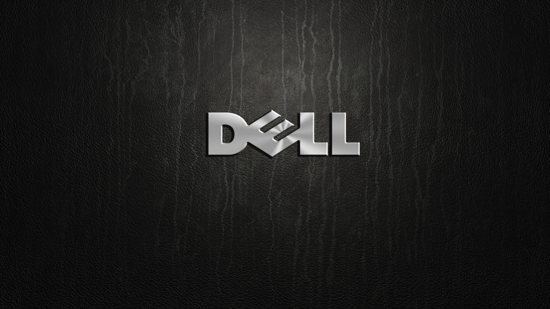 黑色皮革背景上的銀色 Dell 標誌 — Dell 壁紙