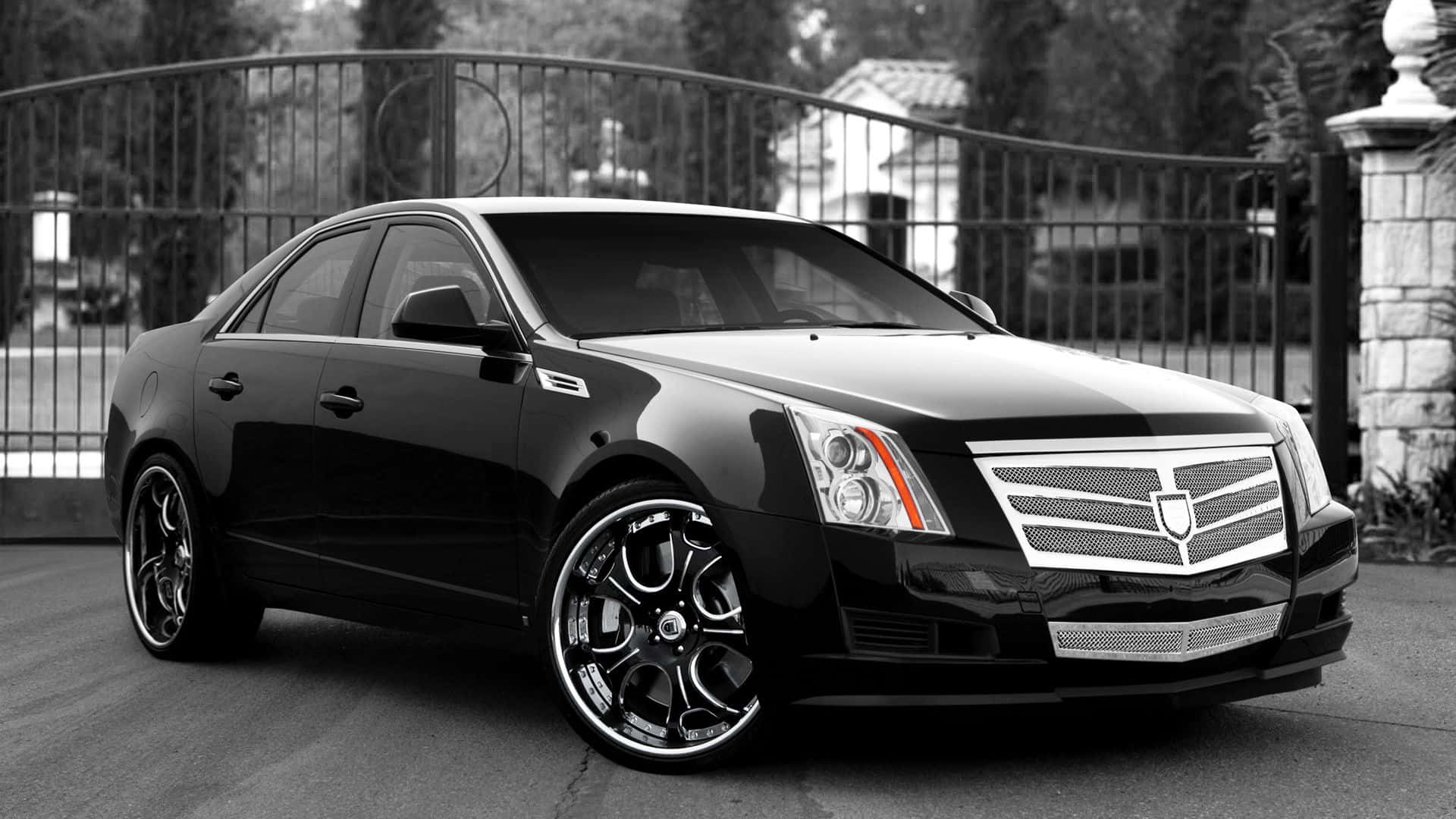 Cadillac Ats 桌布 壁紙 — 一輛時尚的黑色Cadillac CTS-V轎車配備定制輪圈，單色調停放在華麗的大門前。
