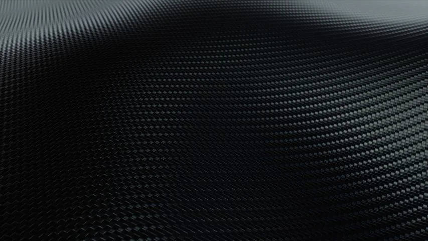 時尚黑色碳纖維紋理，帶有微妙的編織圖案和漸變照明。 — 4K 壁紙