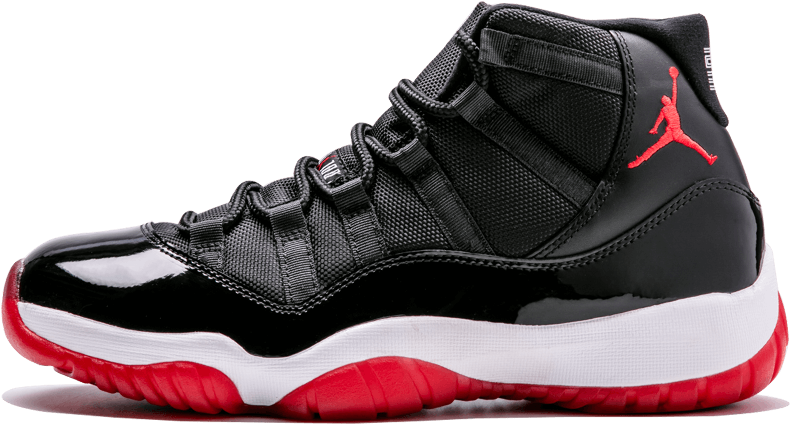 黑色和紅色的 Jordan 11 運動鞋，配有白色鞋底和 Jumpman 標誌 — Air Jordan 壁紙