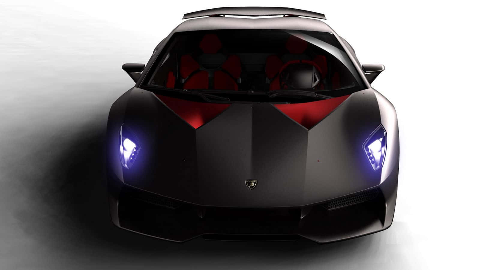 Lamborghini Sesto Elemento 桌布 壁紙 — 從上方俯瞰，一輛時尚的黑色藍寶堅尼跑車，帶有發光的藍色車頭燈和紅色內裝，背景為漸變灰色。