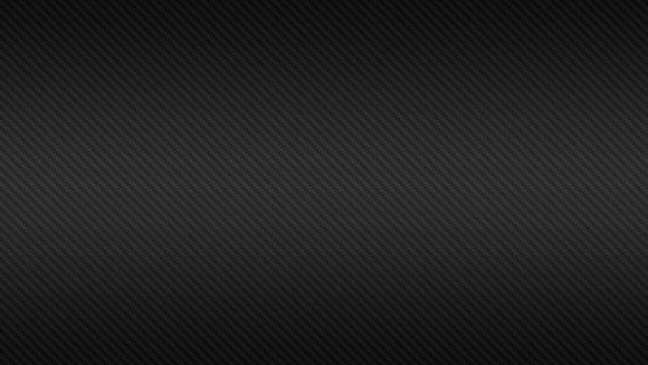 深色碳纖維紋理，帶有斜紋編織和柔和漸變照明。 — 4K 壁紙
