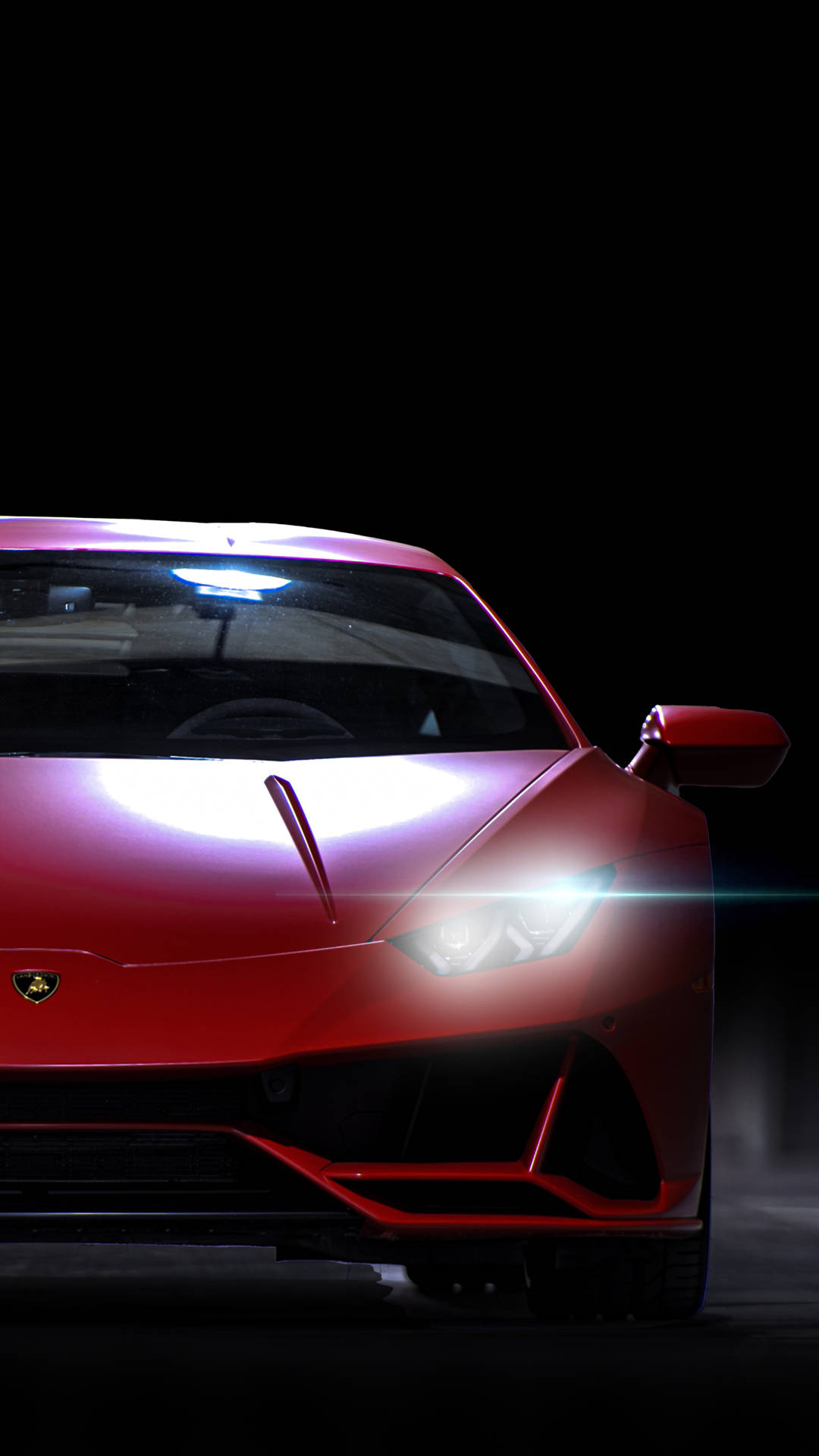 紅色藍寶堅尼跑車在黑暗的攝影棚中車頭燈發光。 — 4K 壁紙