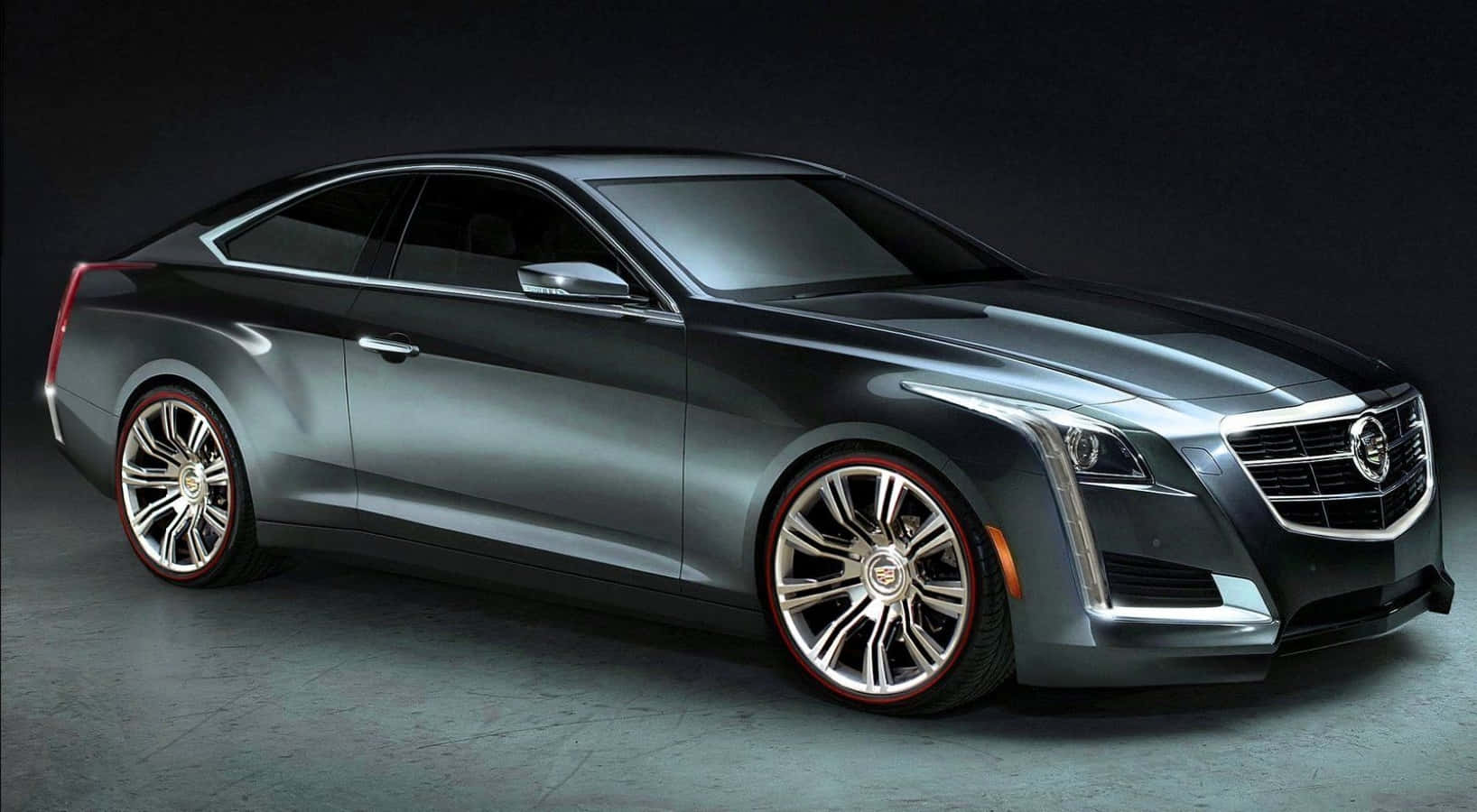 Cadillac Cts 桌布 壁紙 — 一輛時尚的銀色凱迪拉克雙門轎跑車，配備紅色輪圈，在黑暗背景的攝影棚燈光下閃閃發光。