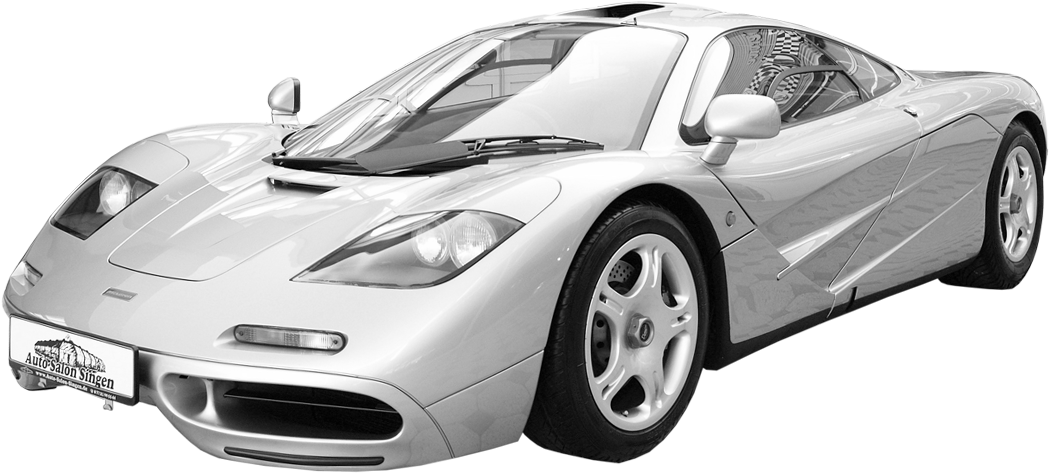 銀色McLaren F1超級跑車，具有空氣動力學設計和黑色背景。 — F1 壁紙