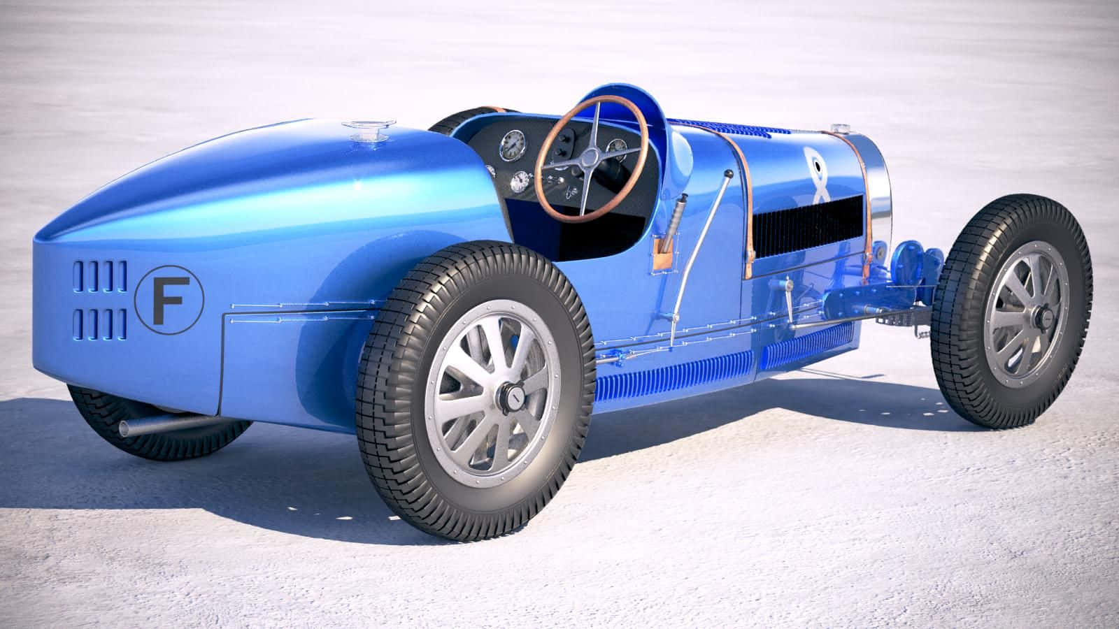 Bugatti Type 41 Royale 桌布 壁紙 — 一架時尚的復古藍色賽車，配有木製方向盤和暴露的機械結構，停在雪地上。
