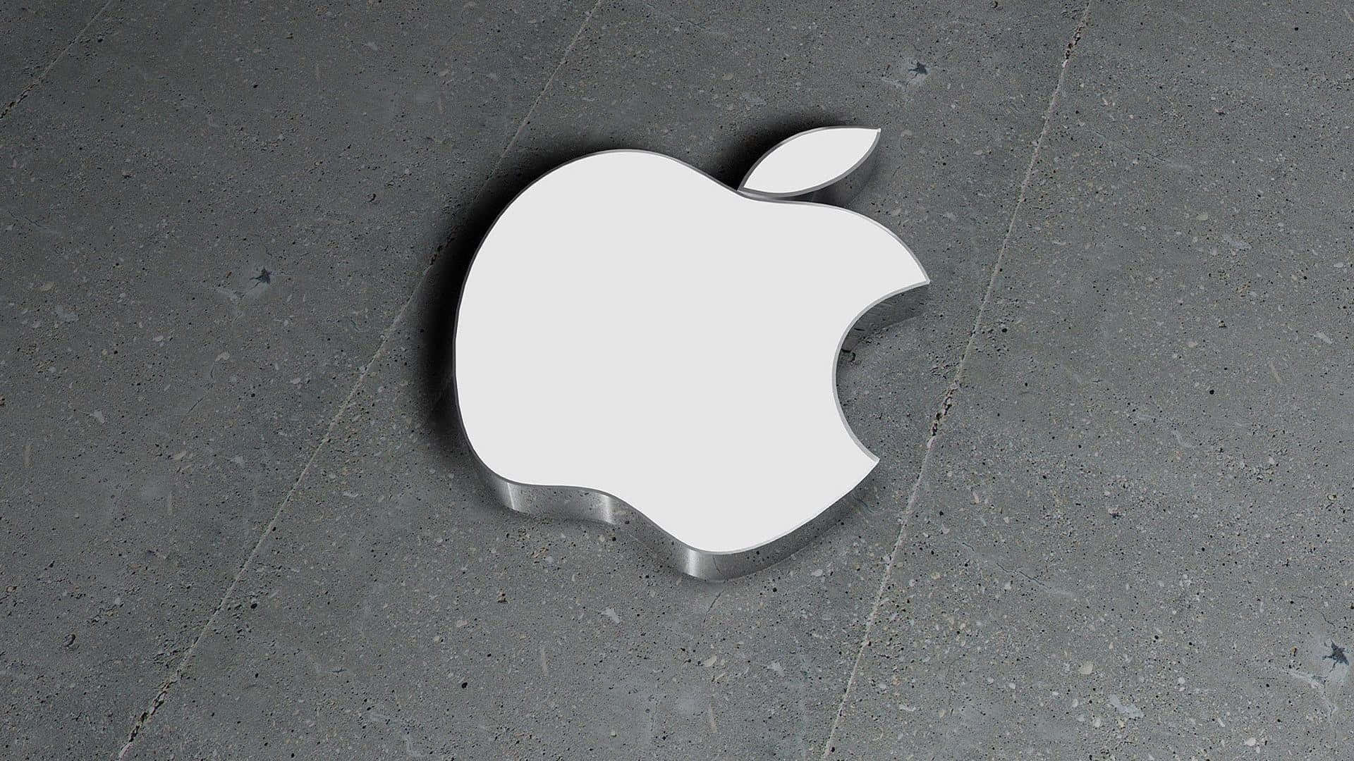 Cement 桌布 壁紙 — 一個帶有金屬邊緣的時尚白色Apple標誌放置在紋理灰色混凝土表面上。